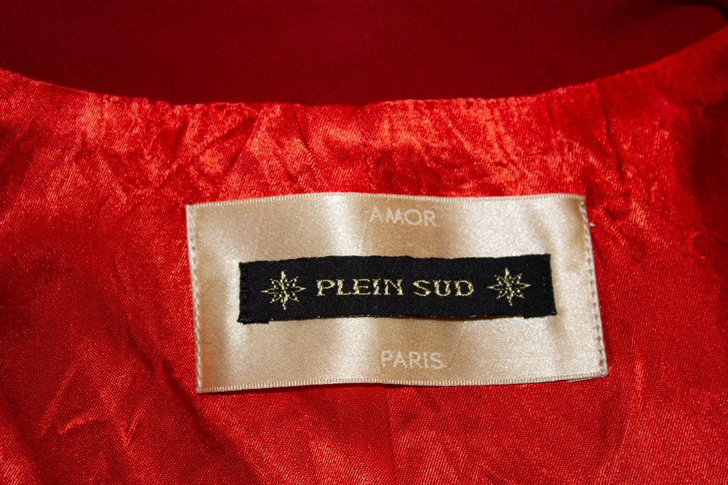 A  great jacket for Spring / Summer by Plein Sud . The jacket is in a bright poppy red colour with a cut away collar and button front opening and cuffs. It is fully lined. Made in France. Size 40 /8 . Measurements: Bust 36'', length 18 1/2''