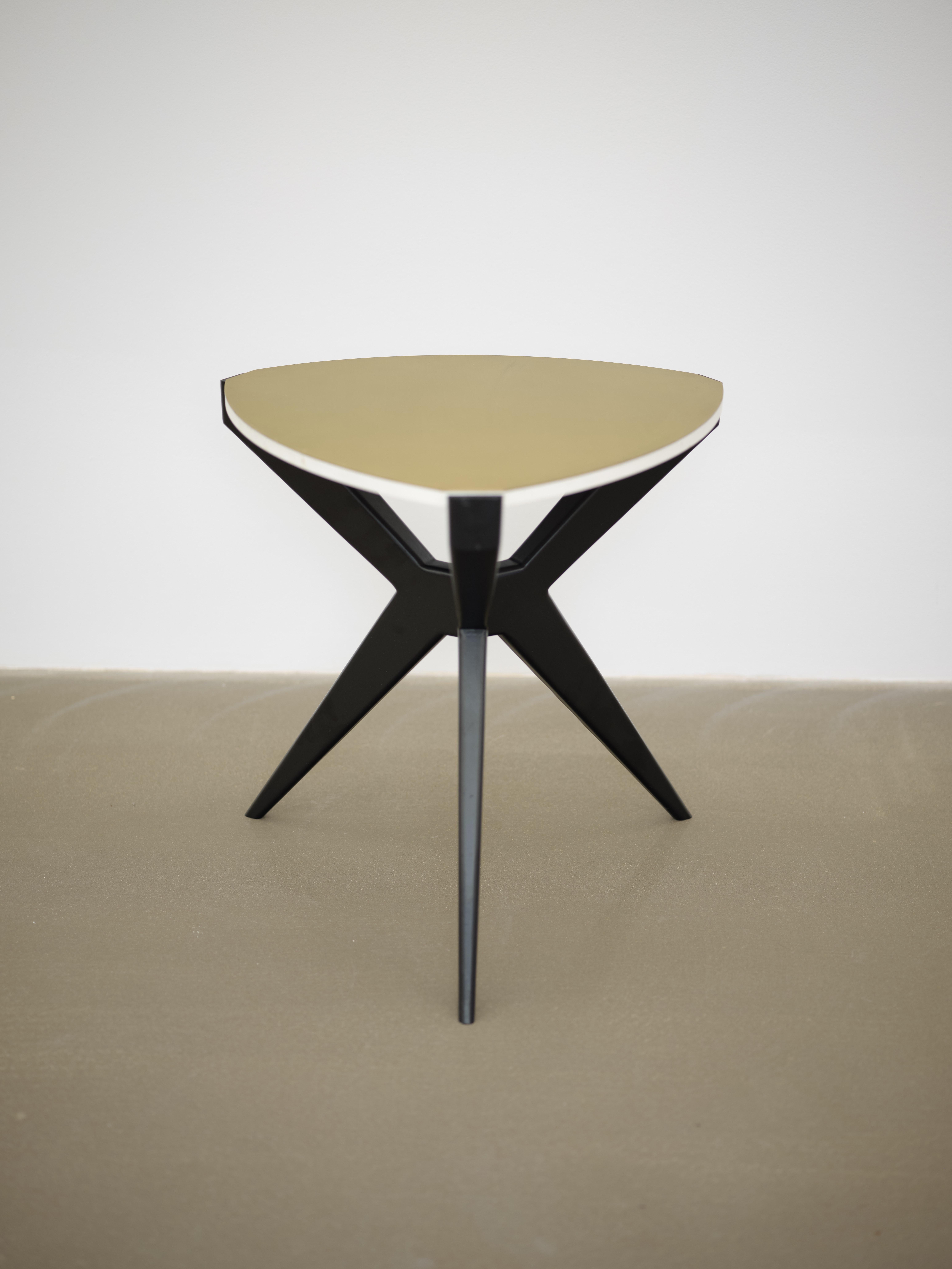 
Plettro is a contemporary side table. This version has black laqueered legs and a brushed brass top.
It's named after the guitar plectrum shape of the stone.
Plettro side table has Sputnik legs that accommodate the stone top like a gem mounted on a
