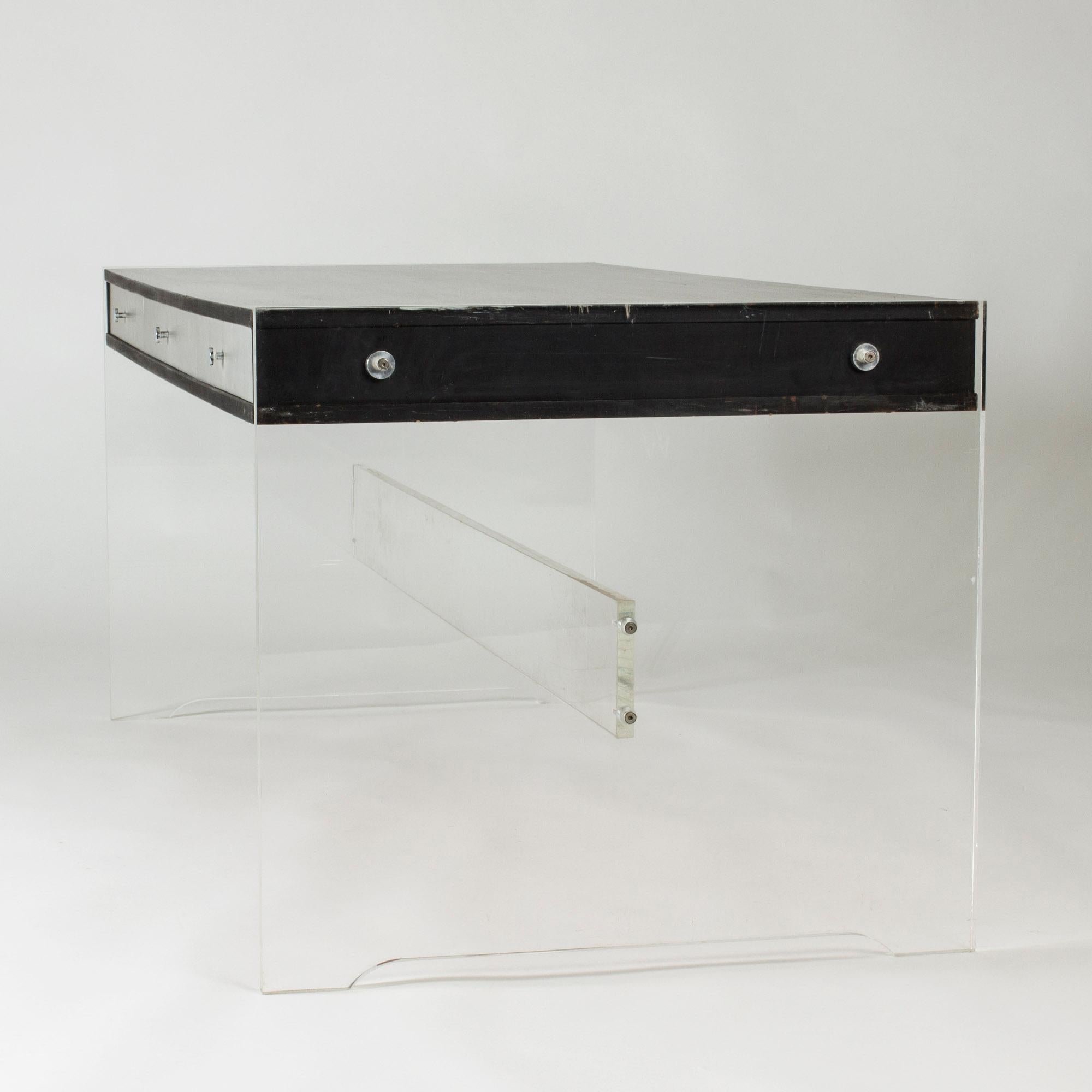 Striking desk by Poul Nørreklit, made from plexi glass with a lacquered wood table top and drawers. Thick, translucent sides, a boxy design with an airy expression.