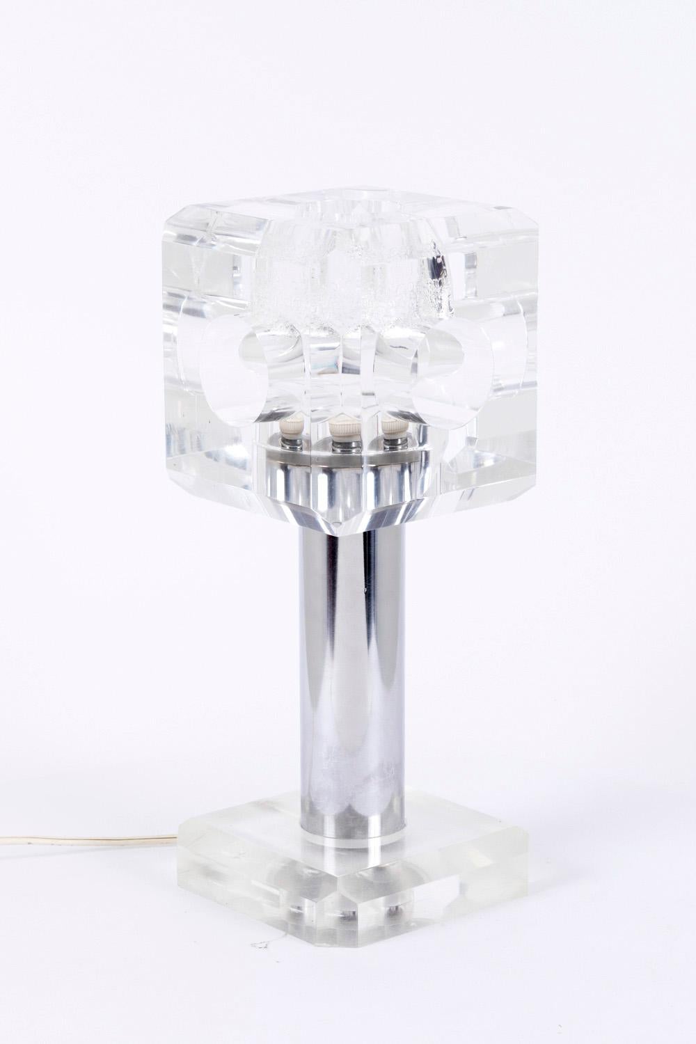 'Cube' lamp, with a plexiglas beveled edges cubic base, a stainless steel cylindrical shaft. Crowned with a cubic plexiglas lampshade. Every cube face is drilled with a cylindrical hole. Bubbles traces in the plexiglas cube due to the light bulb