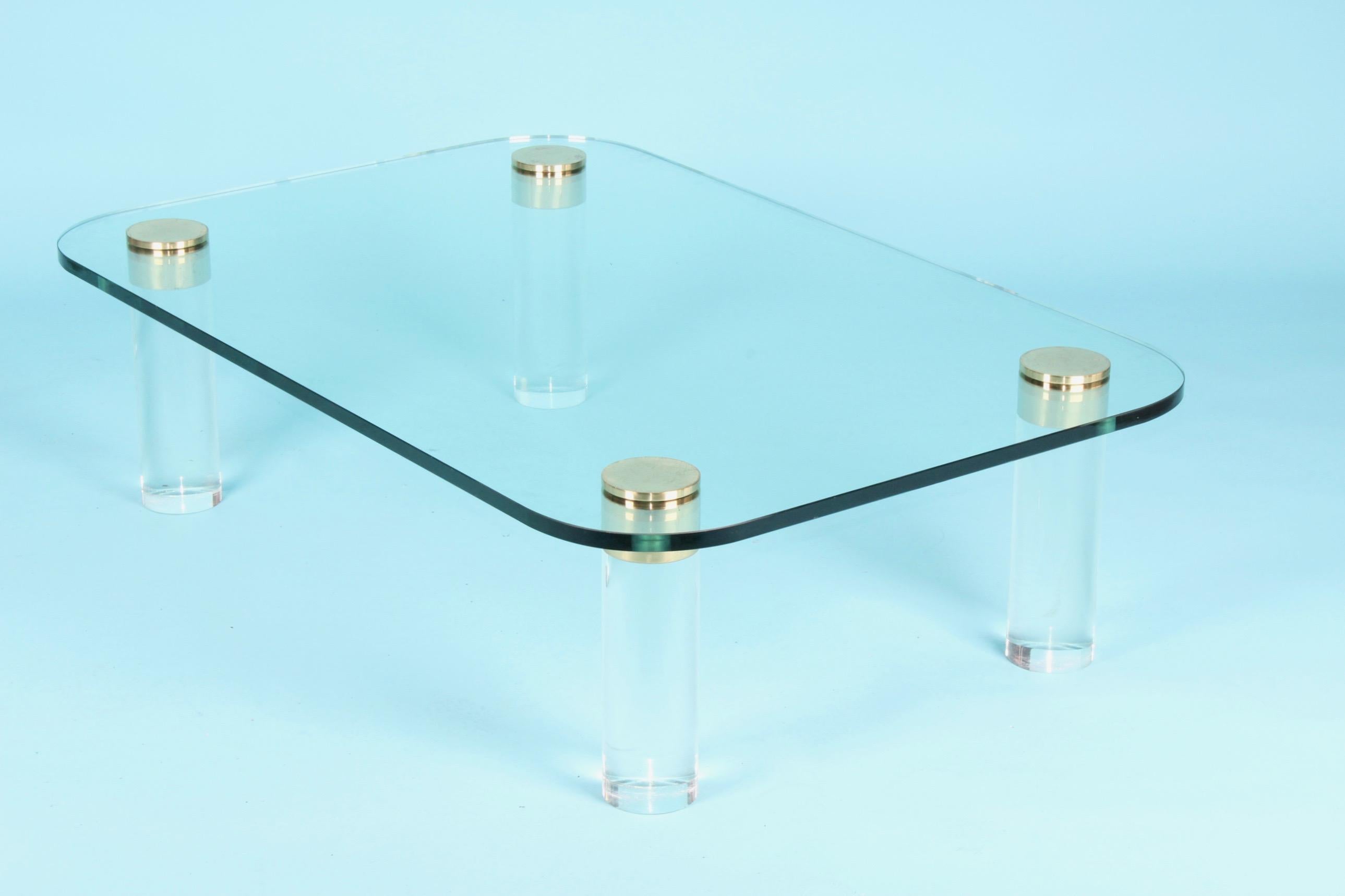 Plexiglas, brass and glass coffee table.
