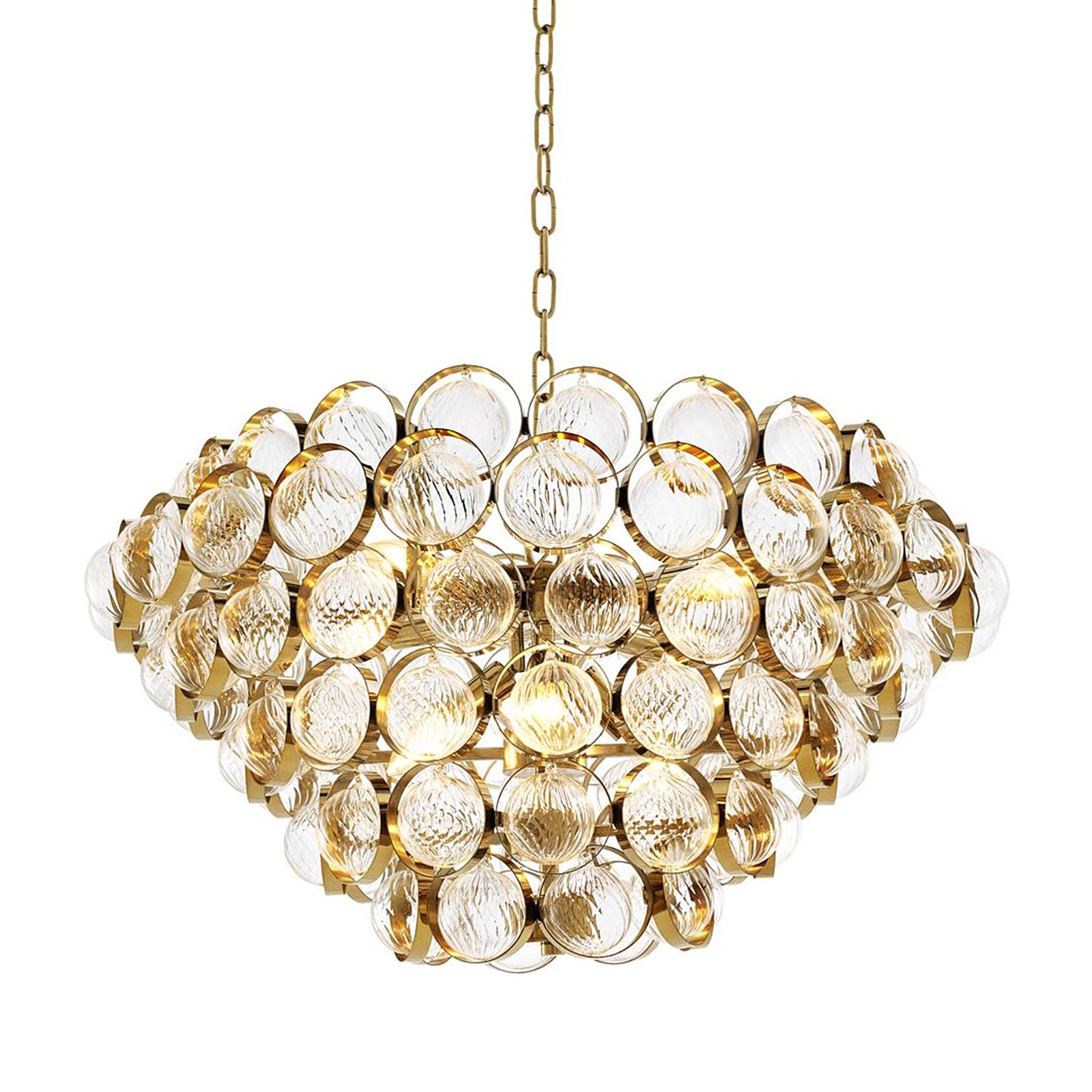 Lampadario Pleyel con struttura in ottone massiccio
in finitura lucida, con vetro trasparente. 8 lampadine, lampada
attacco tipo E14, lampadine non incluse, max 40 watt.
Dimmerabile, dimmer non incluso. Incluso 150 cm
catena di sospensione e