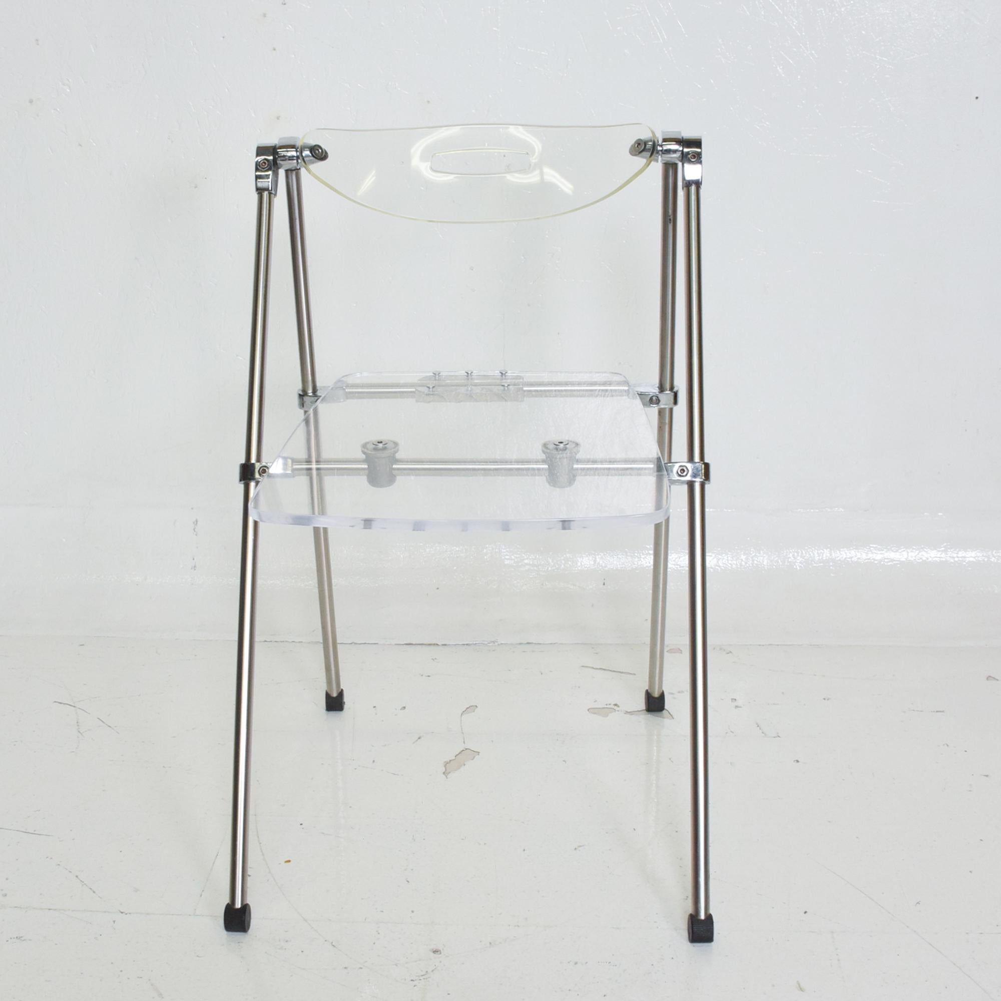 For your consideration: Modern single occasional folding lucite chair with chrome frame after Giancarlo Piretti Castelli Plia folding chair.
Fair. The original seat was replaced with a new Lucite seat and Aluminum support.
Backrest has a stress