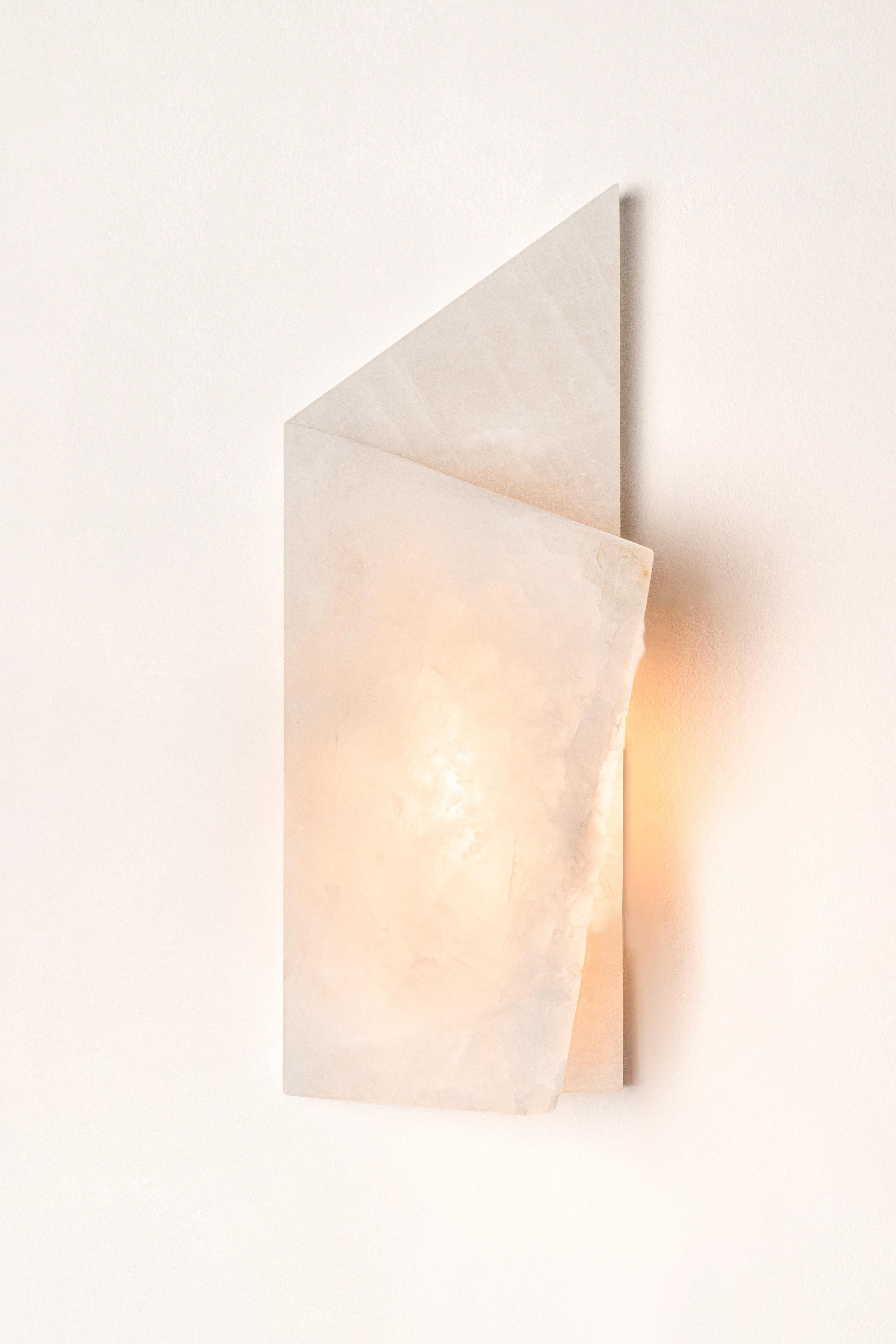 Pliée Light Sculpture by Marie Jeunet
Dimensions: D 14.5 x W 14 x H 38 cm
Materials: Golden quartzite, brushed brass.


--MARIE JEUNET--
From grandparents to framers and lighting manufacturers, a childhood spent next to the
workshop of a great