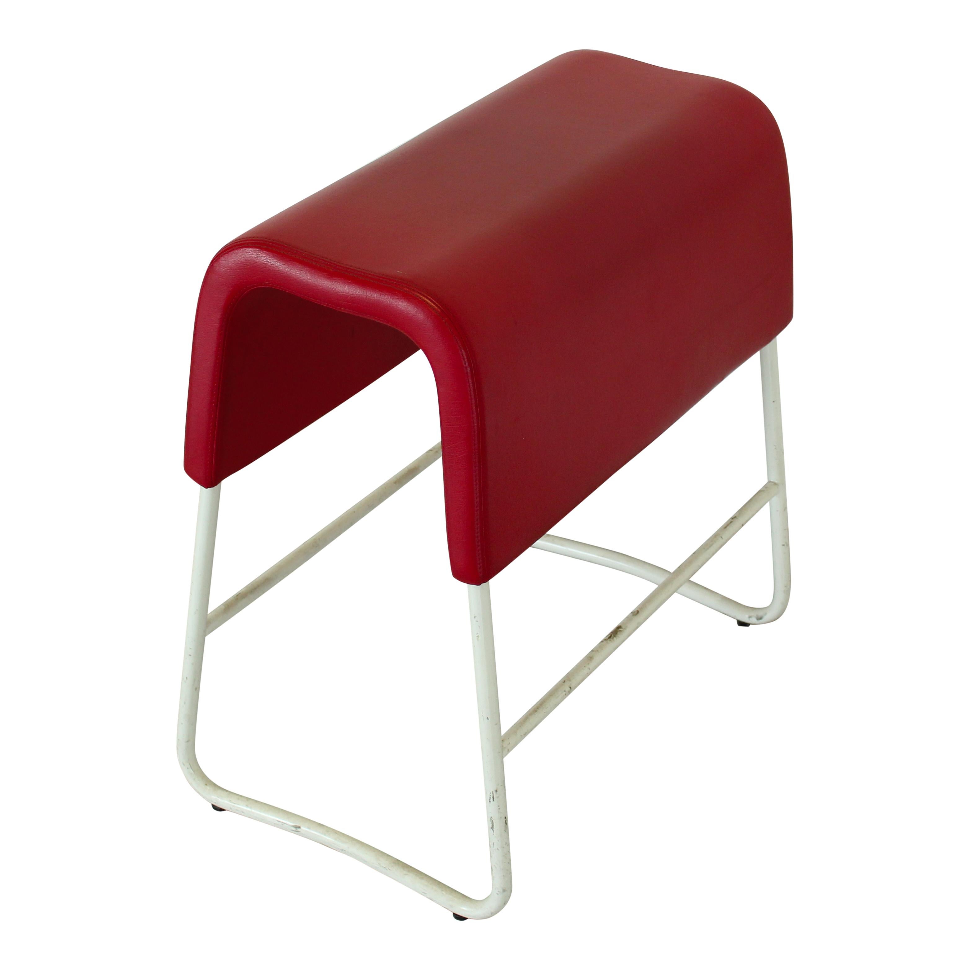 Designed by Sandin & Bülow for Materia in 2001, this Plint stool exemplifies the Scandinavian approach to ergonomic and flexible seating. Produced in Sweden in 2002, the piece features the model’s distinctive narrow seat, upholstered in smooth red