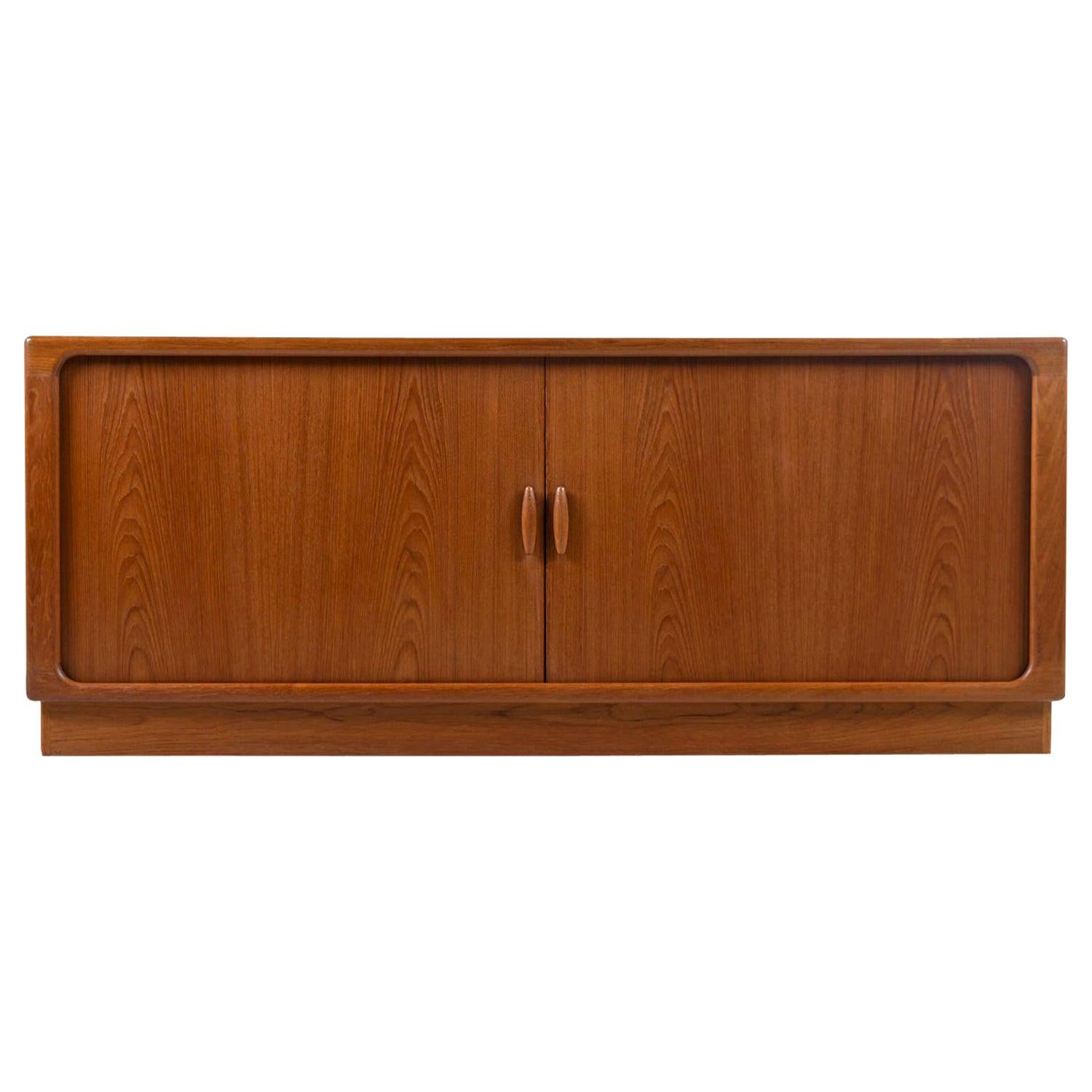Exquisitely crafted vintage 1970s Danish teak credenza by Dyrlund. This is the perfect media center. The large cabinet spaces provide amble room for 12 inch LP records and components. Mount your flat screen above or place on the top with a stand.