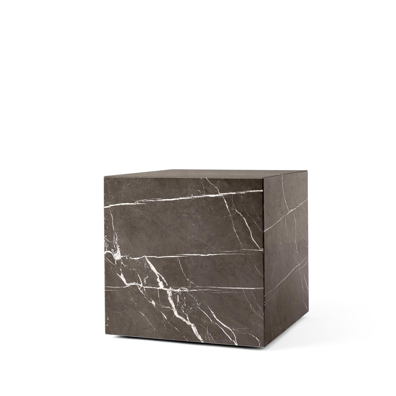 As versatile as it is timeless, the marble Plinth serves the dual purpose of being a beautiful, sculptural piece on its own and highlighting whatever objects rest upon it. The honed marble carries an air of sophistication and elegance to elevate any