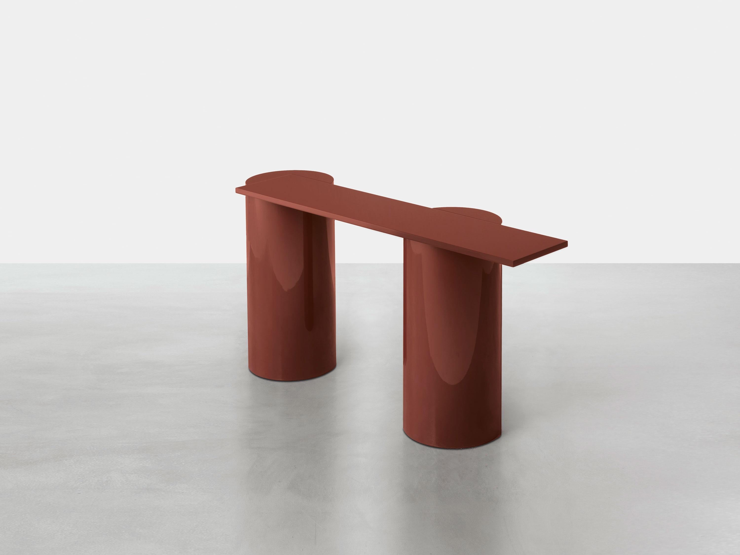 The column legs of this console table have the same relevance as ancient temple legs.
The lofty reference is contrasted by the playful play of the cantilevered top, contemporary in the balance that suggests instability.
Lightened mdf base, available