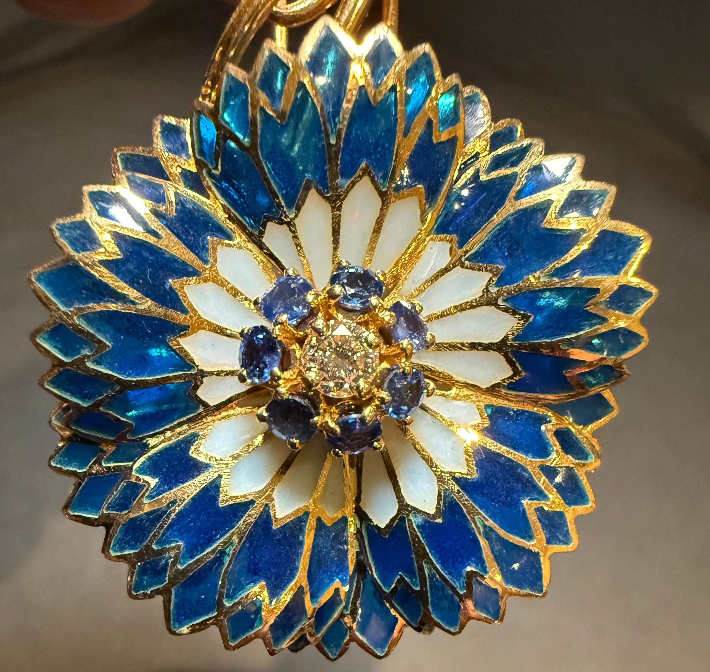 Blue and white Plique-à-Jour 18K yellow gold, diamond and sapphire pin brooch in the form of a flower and vine. Possibly a blue cornflower. 
Round cut diamond .20cts G-color VS2
7 round cut blue sapphires
Weight 21.4g
Fully marked 750. 18with