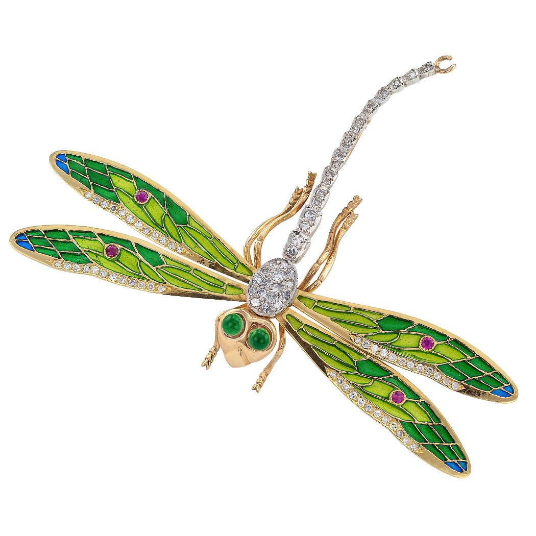 Plique a jour diamond and ruby dragonfly brooch mounted in silver and gold circa 1990. The large-scale 18-karat gold and silver design features green enamel eyes, a diamond-set abdomen and wide spread wings trimmed with diamonds, bezel-set ruby