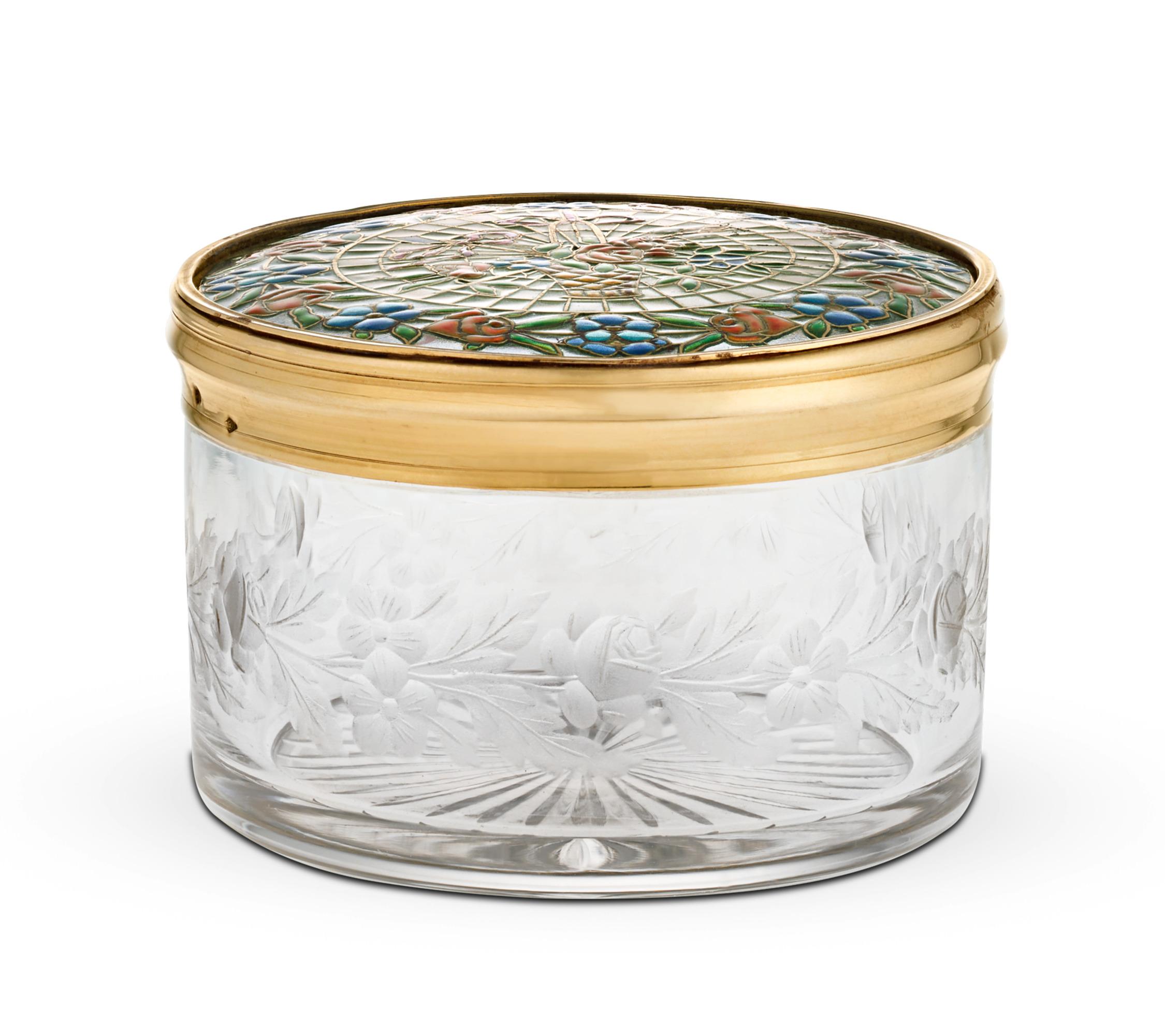 Crafted entirely with an exceptionally detailed enamel technique known as pliqué-à-jour, this French box is a luxurious objet d'art. Exhibiting a subtle translucence like that of stained glass, a floral border surrounds a delightful bouquet. Not to