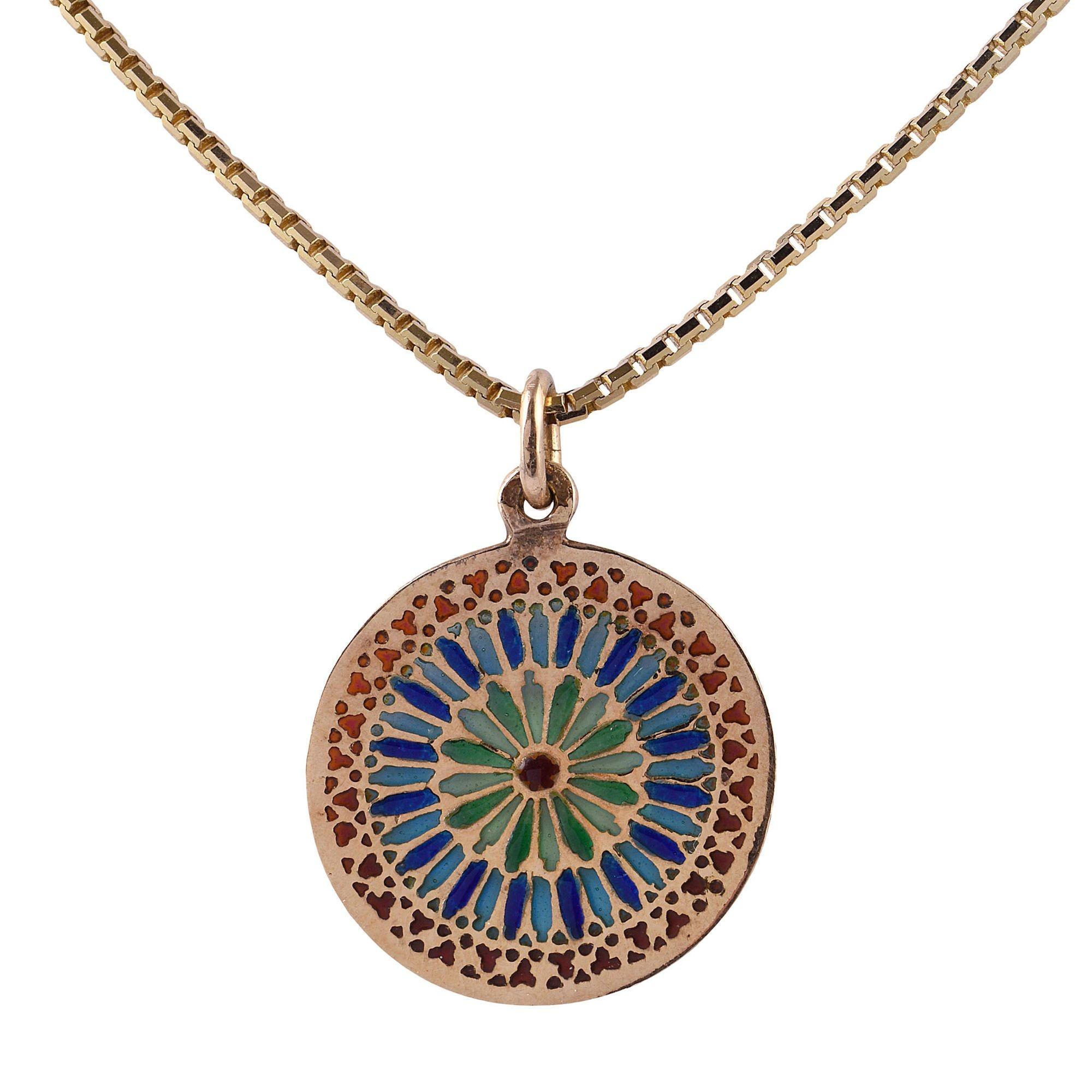 Vintage Plique A Jour enamel pendant necklace. This beautiful round pendant is crafted in 18 karat gold with plique a jour enamel in an intricate mandala style pattern. The vintage enamel pendant comes on a 14 karat gold Italian made chain. [KIMH