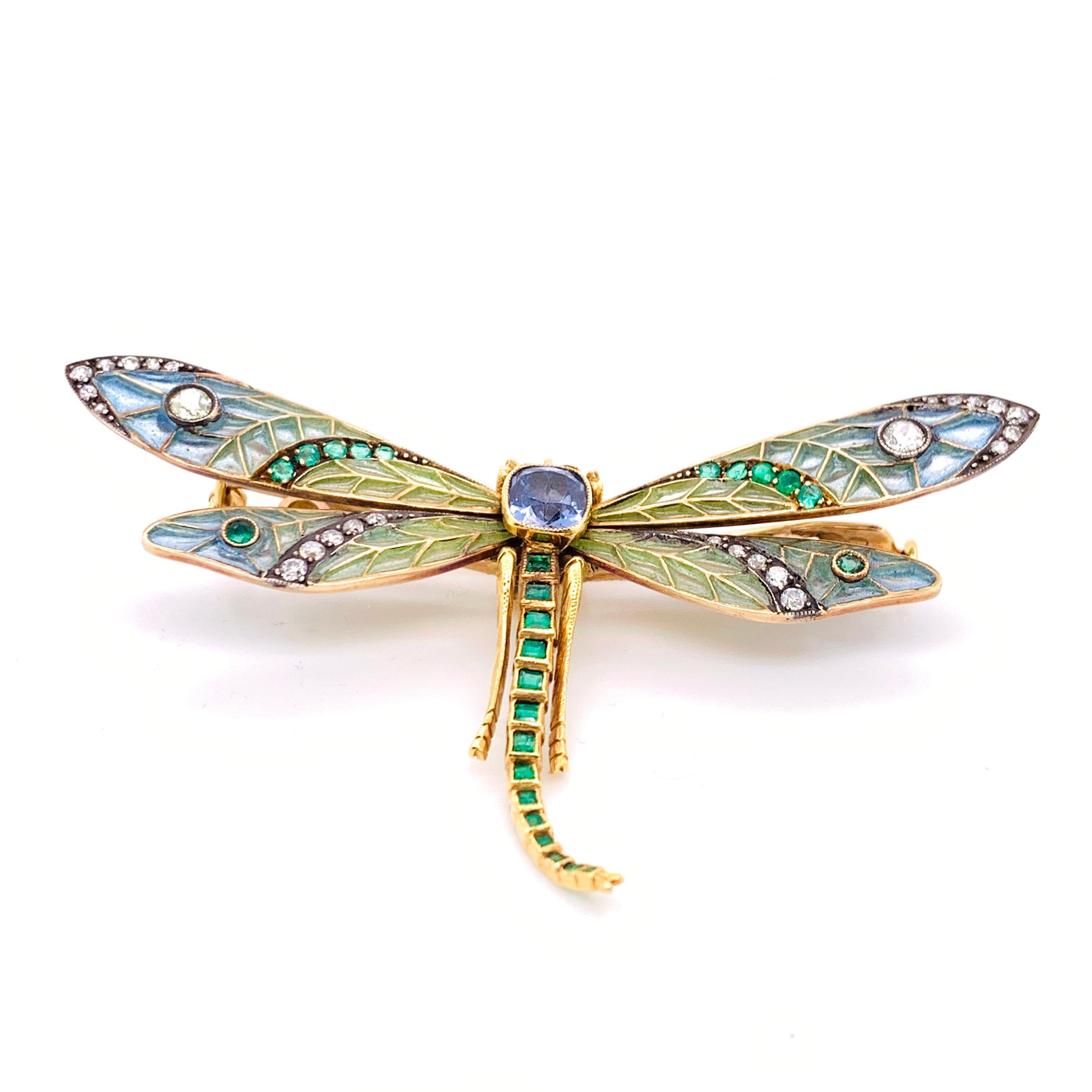 A gem set dragonfly brooch, with a Ceylon sapphire set in the centre, weighing an estimated 1.50ct, with articulated blue to green plique à jour enamel wings, set with an estimated 0.77ct of old-cut diamonds, in silver settings and 0.89ct of