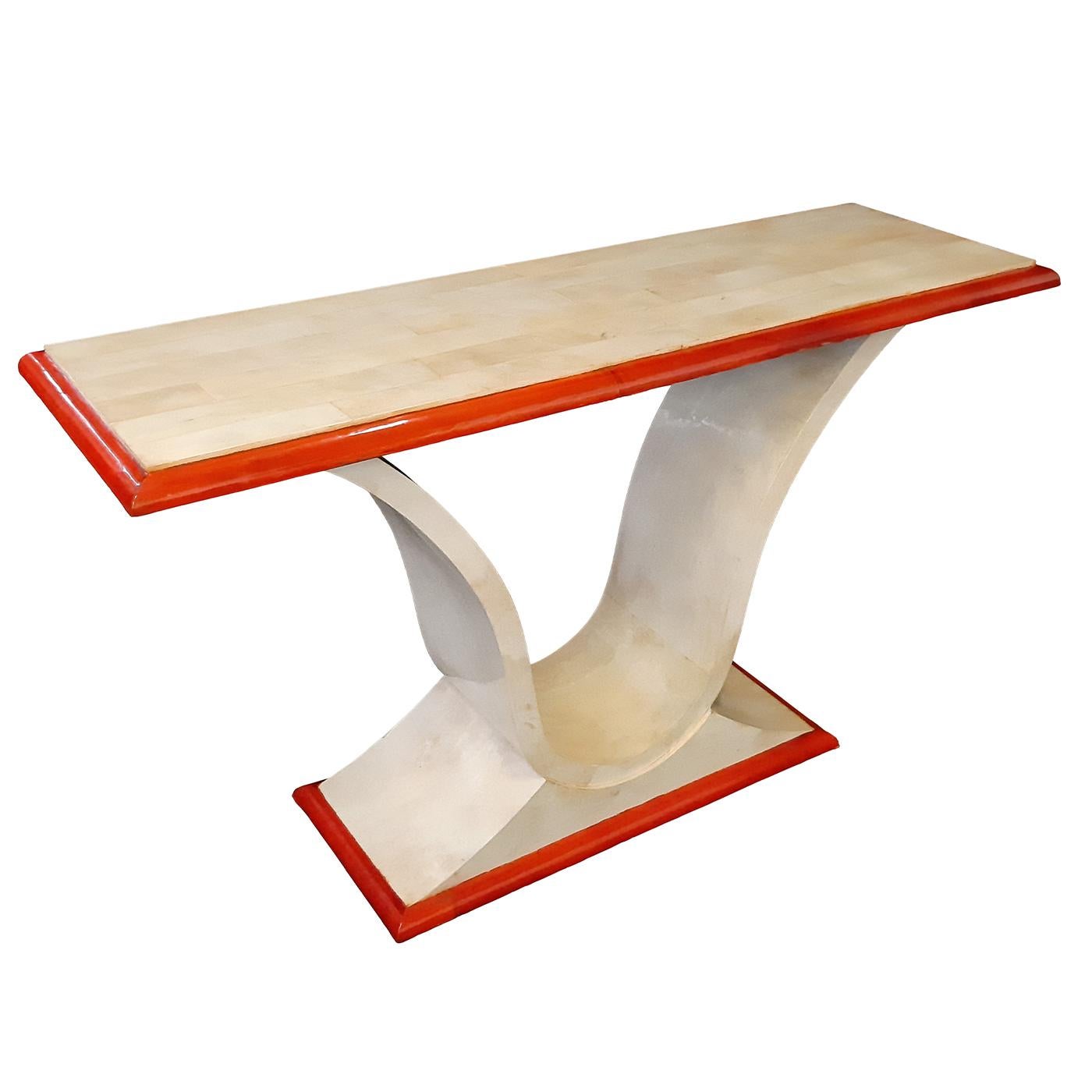 This Art Deco-inspired console couples taste for prized, traditional techniques with a vibrant chromatic twist, red-hued parchment covering the top, and base frames. First-rate natural parchment in a versatile shade of ivory envelopes in a tight