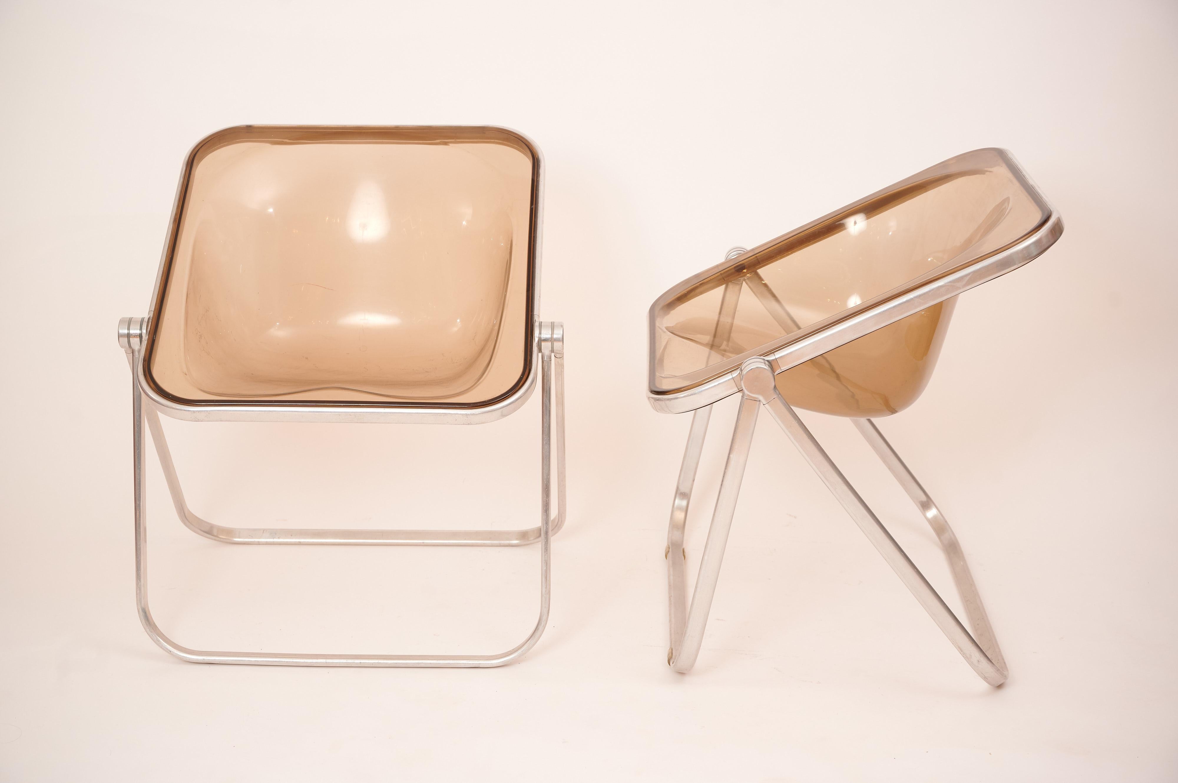 Plona chairs in a rare beige smoked acrylic. 

