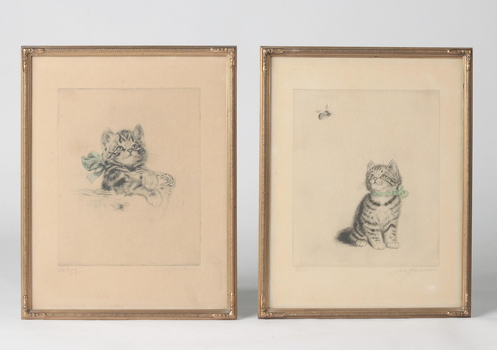 Beautiful set of two antique etchings by Meta Plückebaum. This German female artist was very famous for her artwork with cats. These two etchings are signed in pencil. The etchings are framed in elegant gold-colored frames behind glass.

Meta