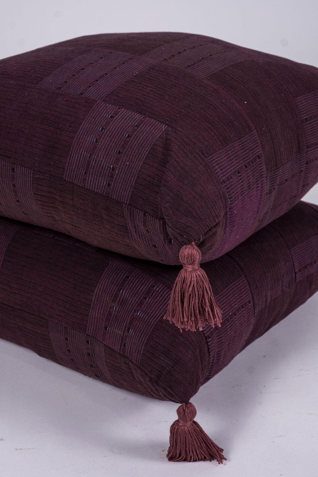 Plum color cushions with tassels, front and reverse made from vintage African fabric woven from wild silk and cotton. Includes zipper and feather insert. Two available. Sold separately and priced $440 each.