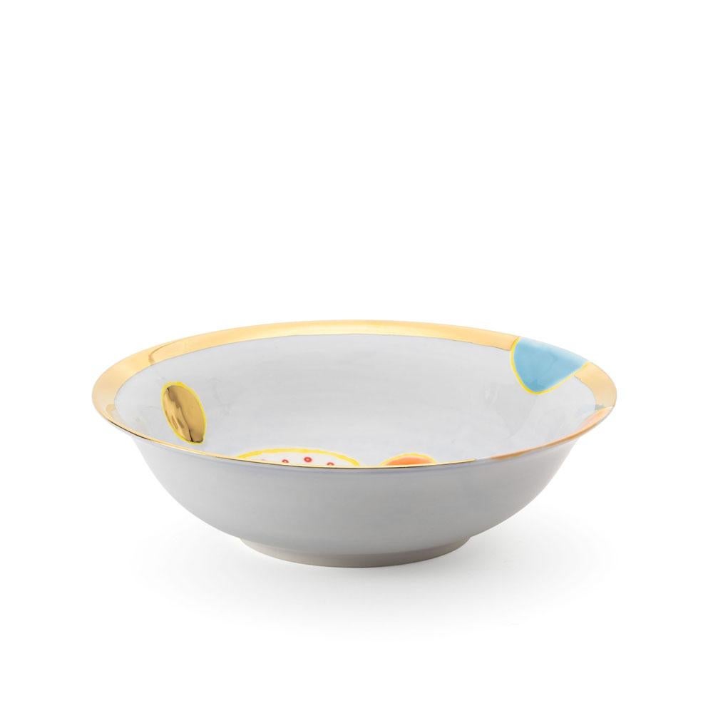 The Gold Impressions collection takes Coralla's exploration of geometry and minimalism to a new dimension, infusing her iconic designs with radiant gold accents. These golden elements transform familiar symbols, like the Mountain, into luminous