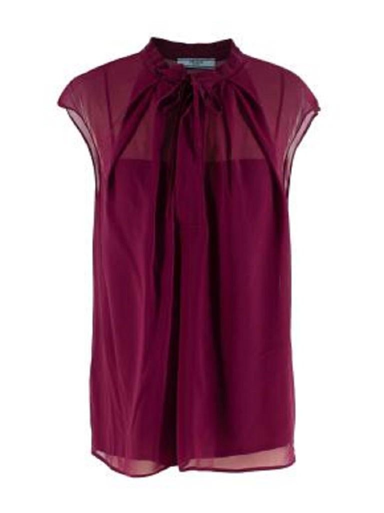 Prada Plum Silk Chiffon Lavaliere Sleeveless Blouse
 
 - Fine silk chiffon, with a tonal slip
 - Self-tie lavaliere collar
 - Concealed buttons at chest 
 
 Materials 
 100% Silk 
 
 Made In Italy 
 Dry Clean Only 
 
 9.5 excellent condition 
 
