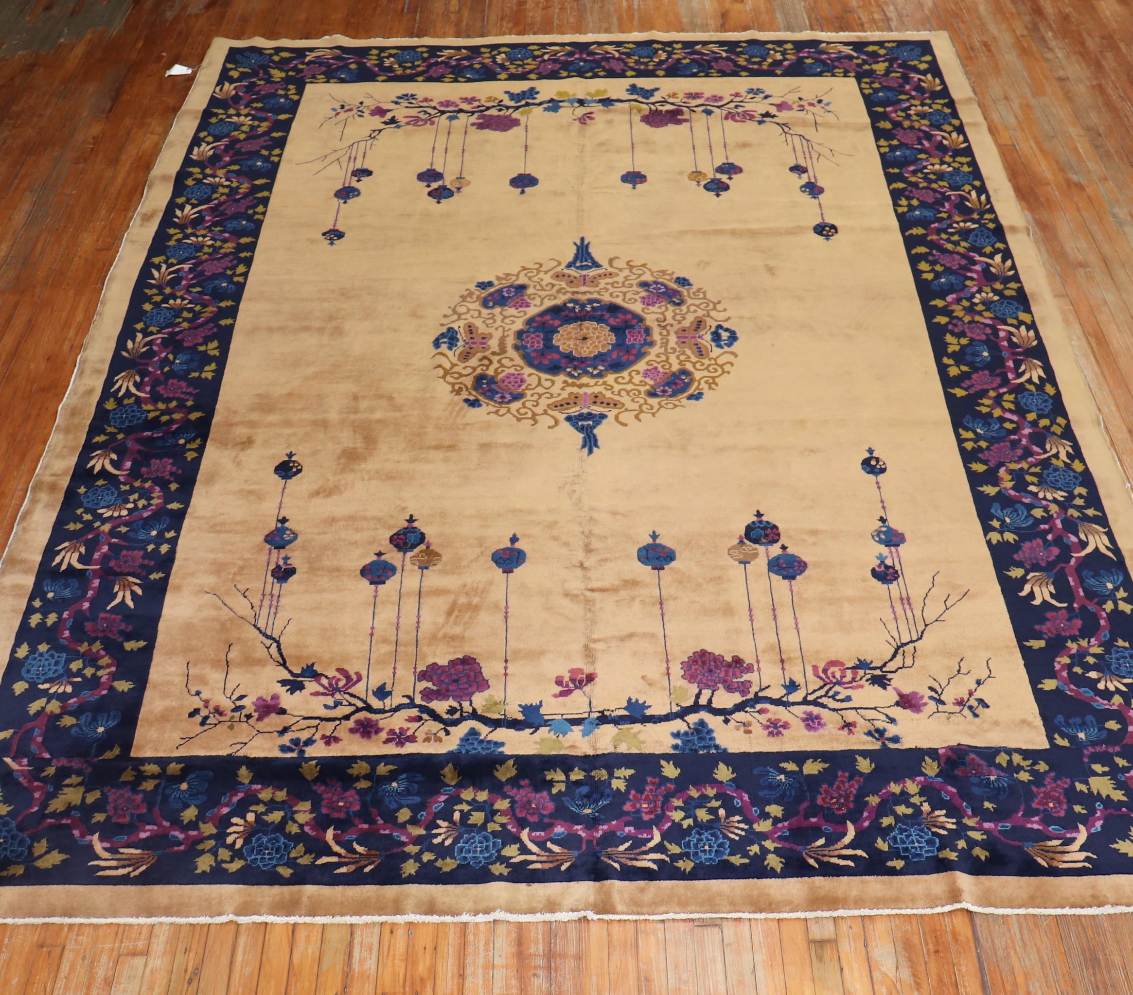 An authentic mid-20th century Chinese Art Deco with an enchanting floral motif in predominant plum, wine, navy blue accents on a beige ground.
Room size formats are usually found in the 8 x 10, 9 x 12 size range, this one is slightly shy of 10 x