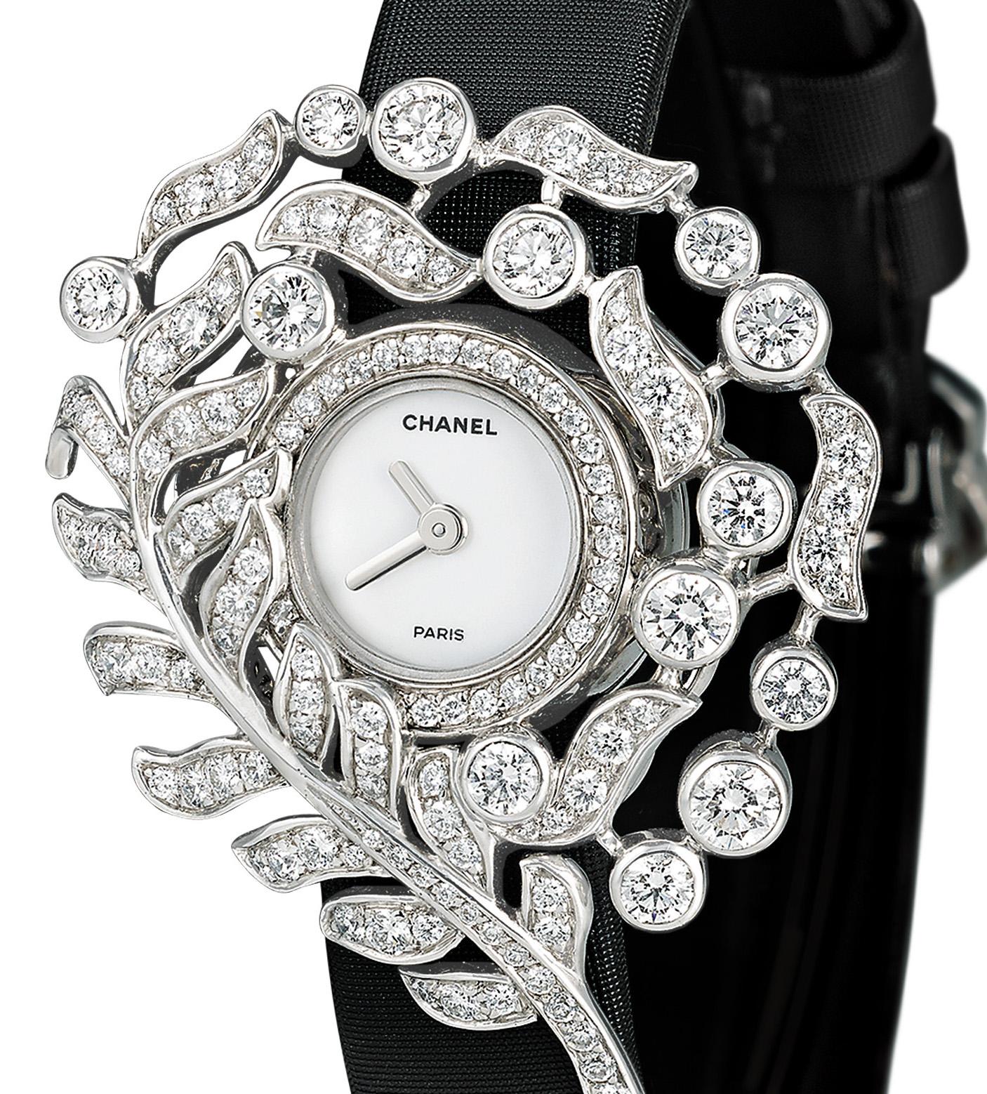 This chic diamond watch from the Plume de Chanel collection is an ode to Coco Chanel's love of feathers. White diamonds totaling 2.74 carats form a feather motif around the sleek white watch face, while the watch itself features an Audemars Piquet