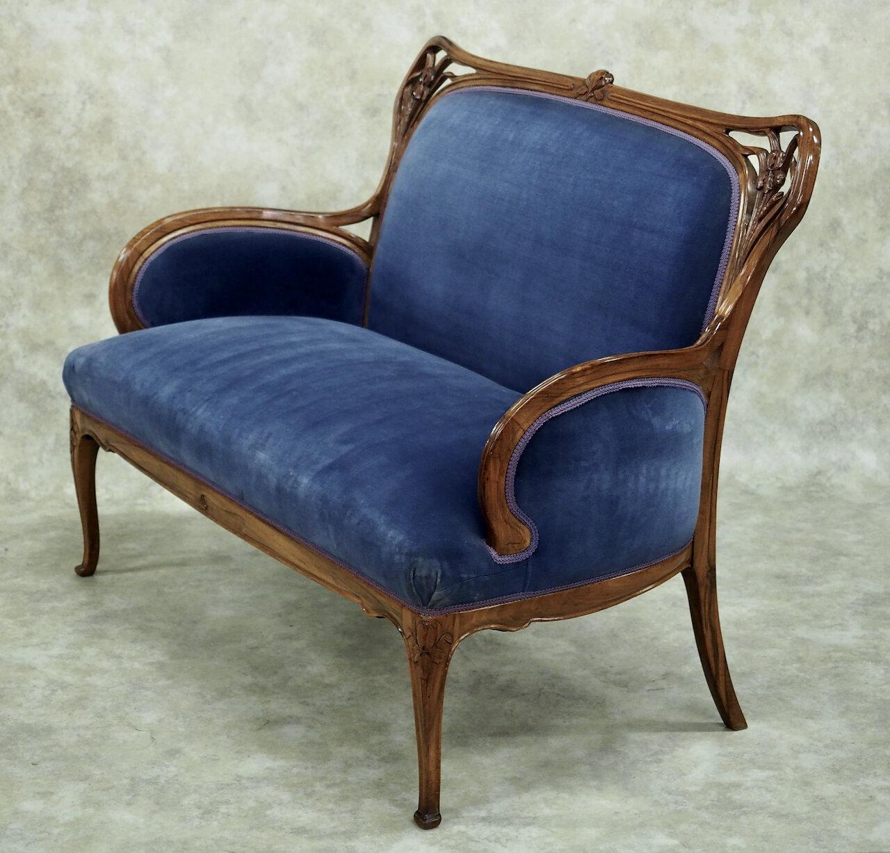 French Art Nouveau seating suite by Plumet et Selmersheim, circa 1900, in solid sculpted rosewood. Set consists of settee, pair of armchairs, pair of side chairs, all refinished and reupholstered. 

Dimensions: 
Settee 52” wide x 22” deep x 38”