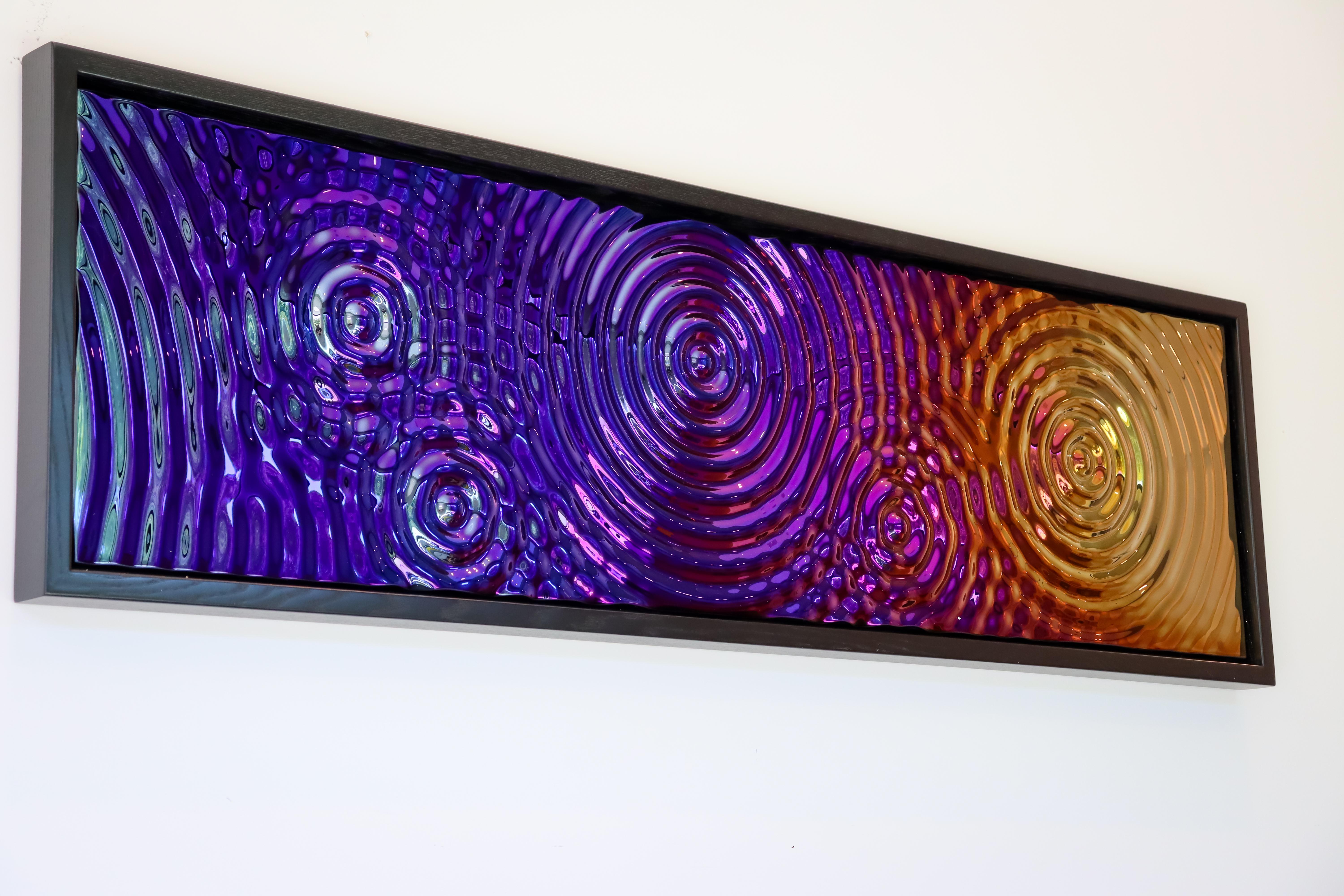 Multicolor Glass wall panel «Interference»‎ is the magic of water frozen in glass. Titanium-coated glass elements create a feeling of vibration on the water's surface.
