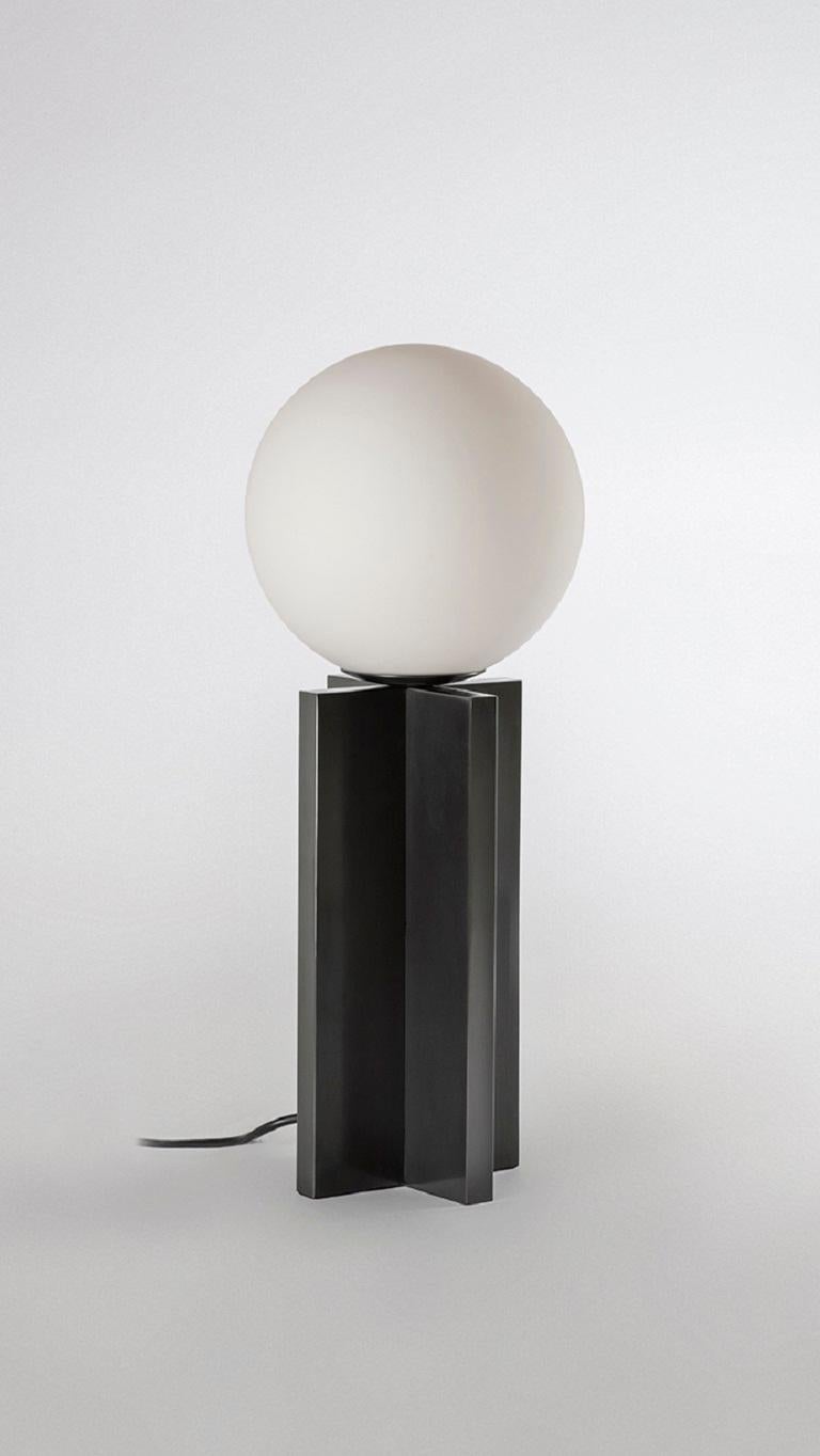 Plus table lamp by Square in Circle, 2022
Dimensions: H 50 cm x W 15 x D 15 cm
Globe diameter: 20 cm
Materials: dark bronze finish, white frosted glass

Our Plus Table Lamp features two simple dark bronze panels, one positioned vertically and