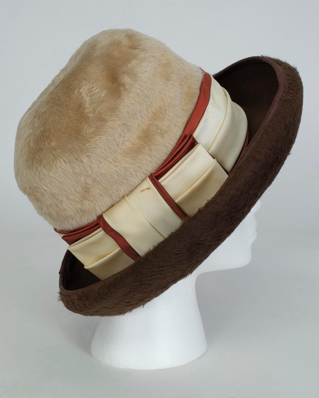 Like Fedoras, bowler hats look particularly good on women because of their typically masculine association. This one takes androgyny a step further by combining an oversized crown, graphic color blocking and plush beaver fur. Uncannily similar to a