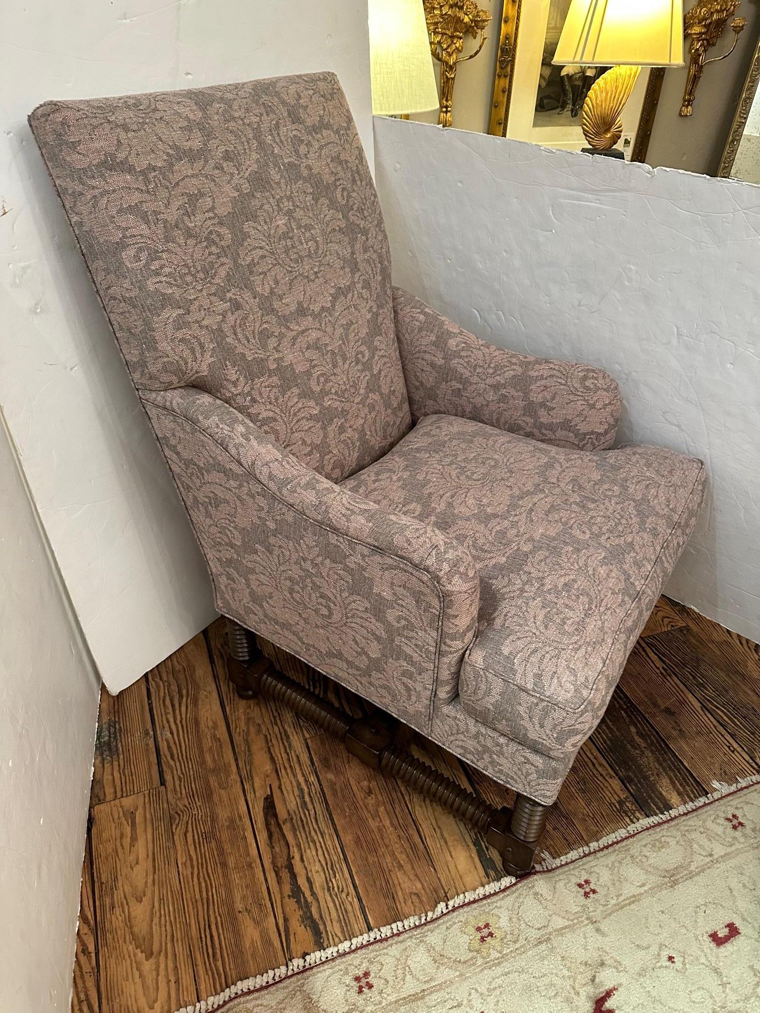 Super comfortable plush custom upholstered club chair with English arms, down and feather loose seat cushion, and gorgeous walnut turned legs and supports. Fabric is a linen blend woven damask in soft shade of neutral rose and flax. It's the Tuscany