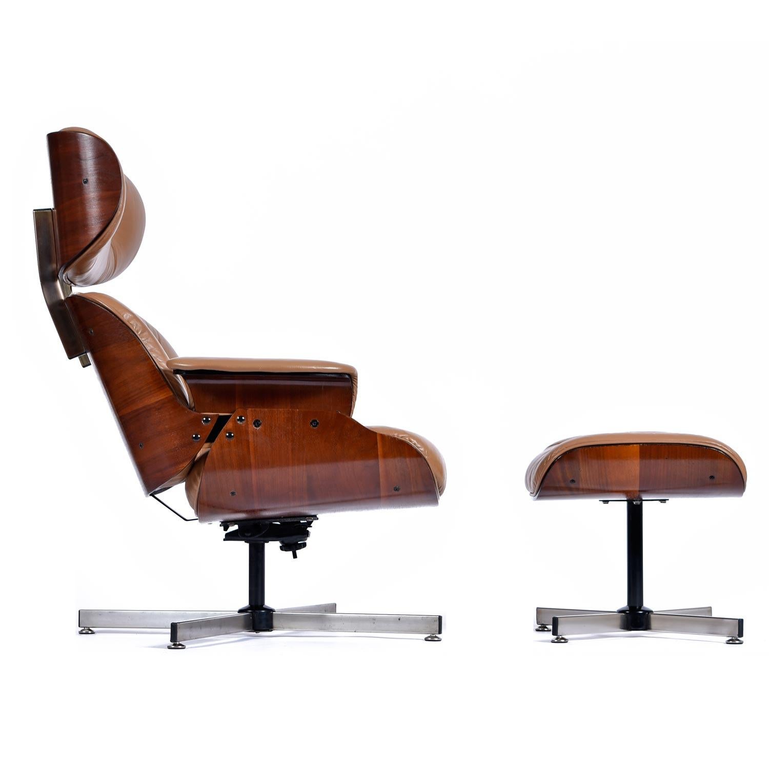 Beautifully restored Mid-Century Modern swivel lounge chair and matching ottoman by Plycraft. The original tag is missing, but it's definitely Plycraft. Gorgeous, tufted light-caramel faux leather with bentwood walnut wood frame. The aluminum base