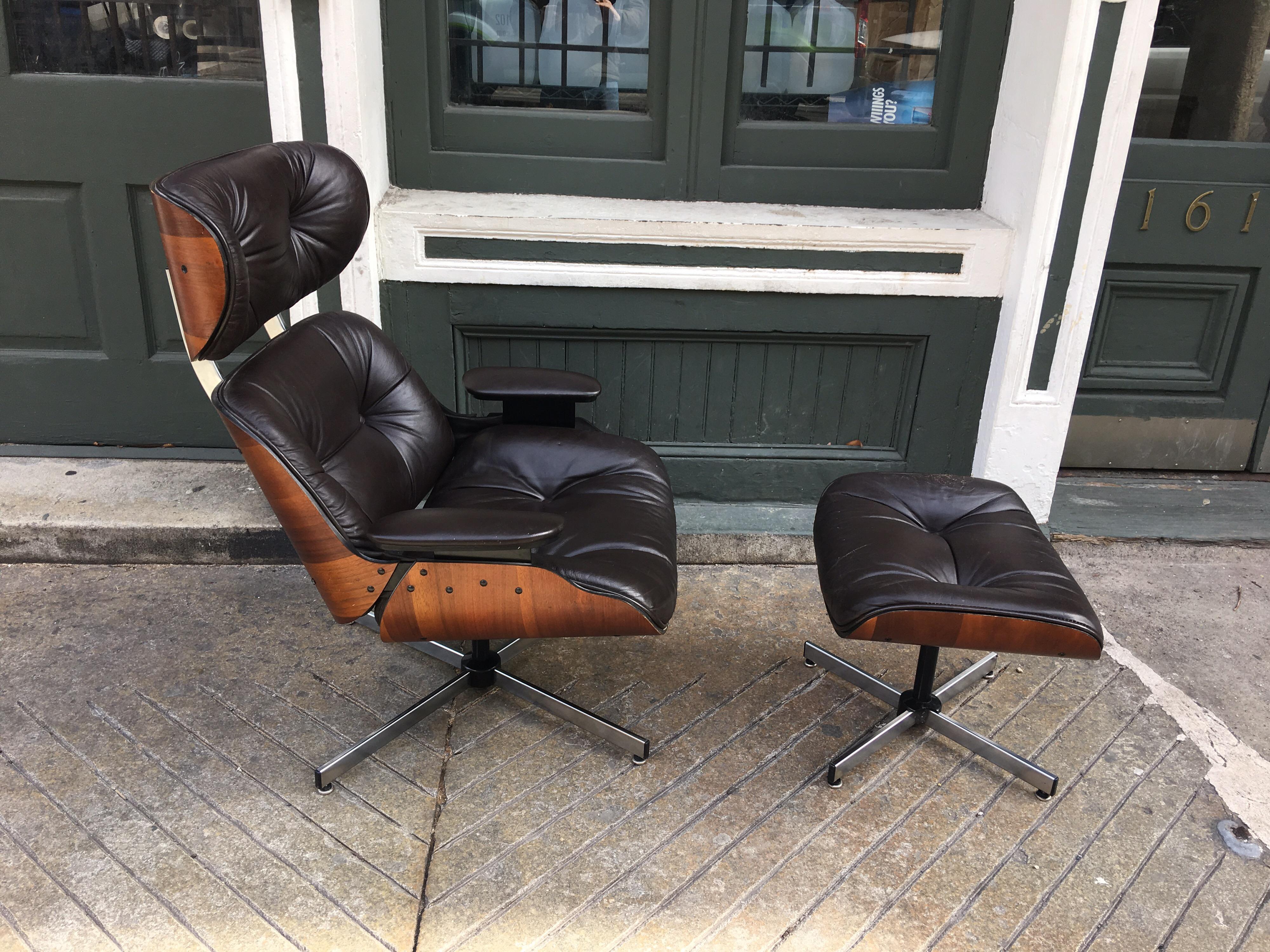 Plycraft Selig lounge chair and ottoman in walnut with chocolate brown vinyl interior cushions. Higher back than the Eames design makes this a very comfortable alternative design choice from the Herman Miller model.