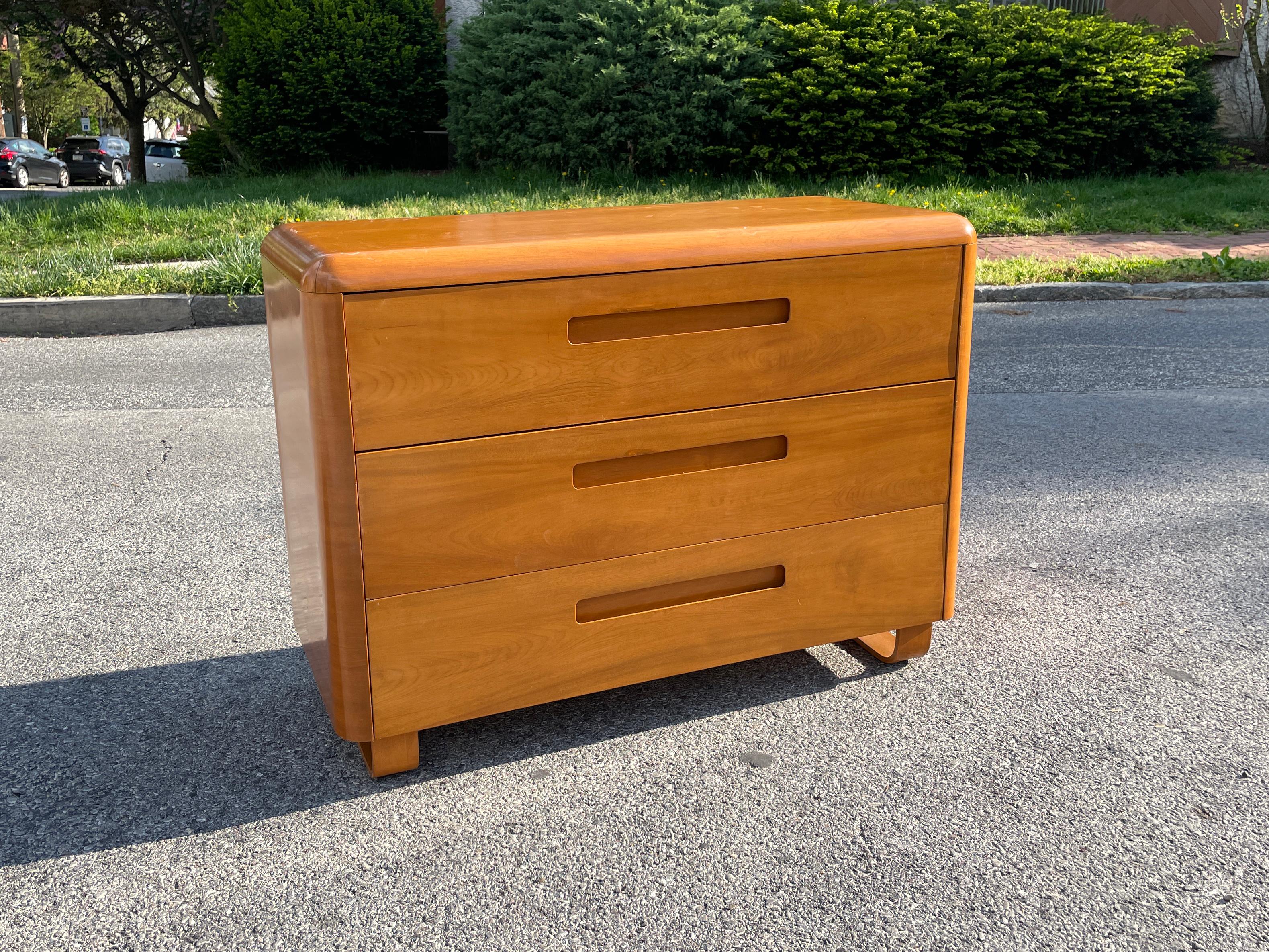 A beautiful mid-century three-drawer low dresser with bentwood legs designed by Paul Goldman for his 
