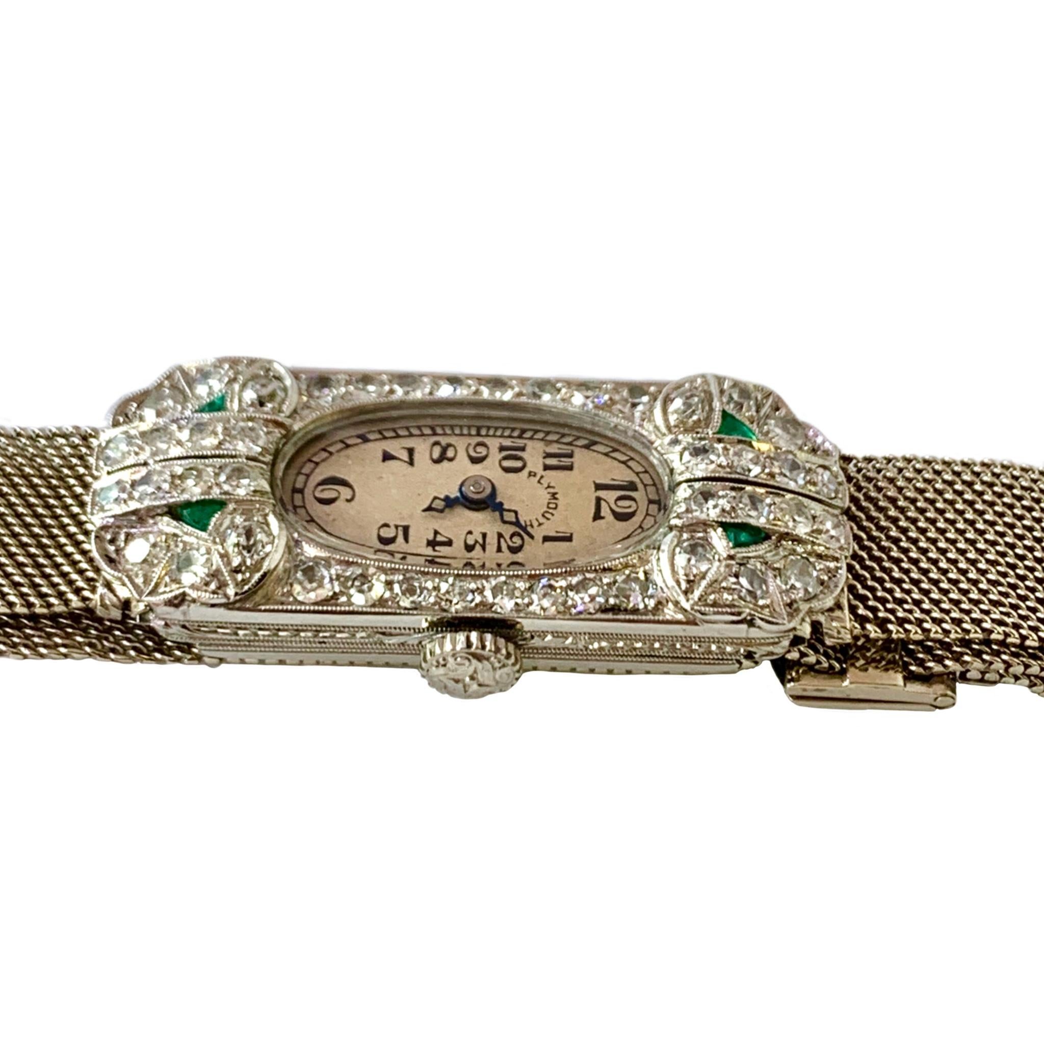 Art deco, circa 1930's Plymouth watch with platinum case and 14K white gold adjustable mesh bracelet set with 44 single cut diamonds total weight approximately 1.32cts and 4 small shield shape emeralds. 