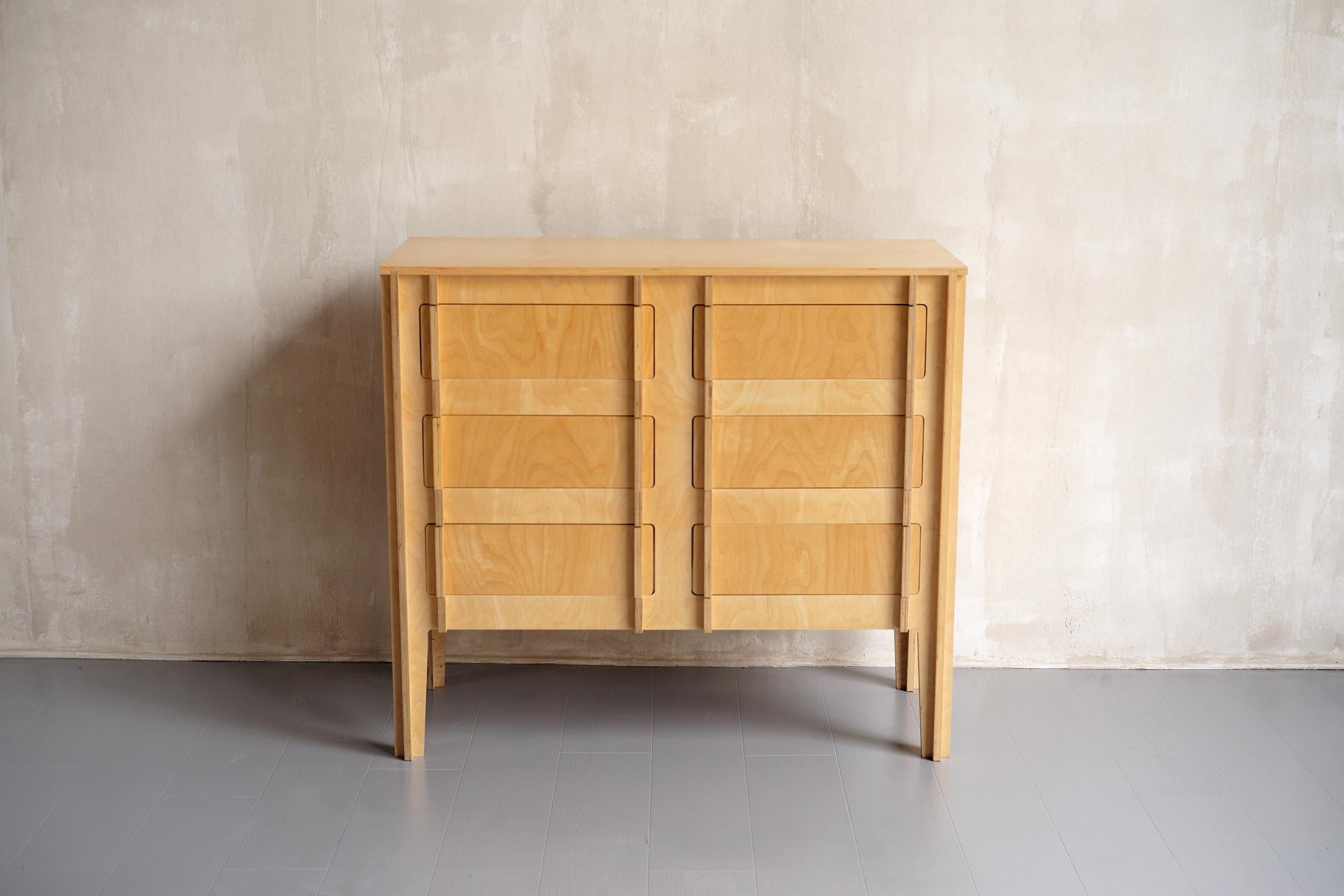 Birch plywood bookcase, Finland 2000. Consisting of a six-drawer chest of drawers and a bookcase, this set can be arranged separately or stacked. Remarkable for its design and conception, this furniture is assembled by interlocking, without screws,