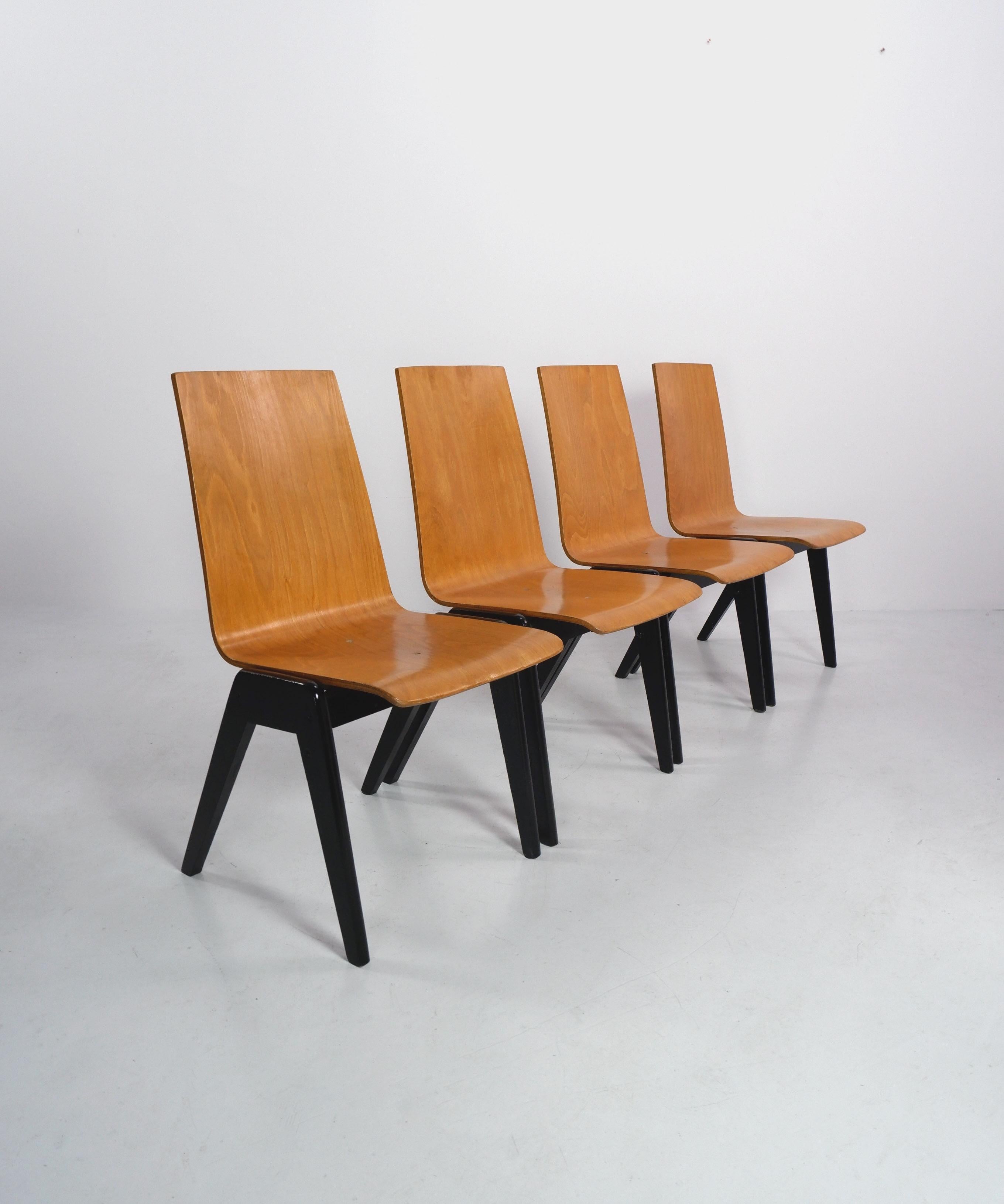 Plywood stacking chairs attributed to Austrian architect Roland Rainer. 

There are 7 chairs available, price is per chair. 

Dimensions (cm, approx): 
Height: 87
Width: 48
Depth: 55.