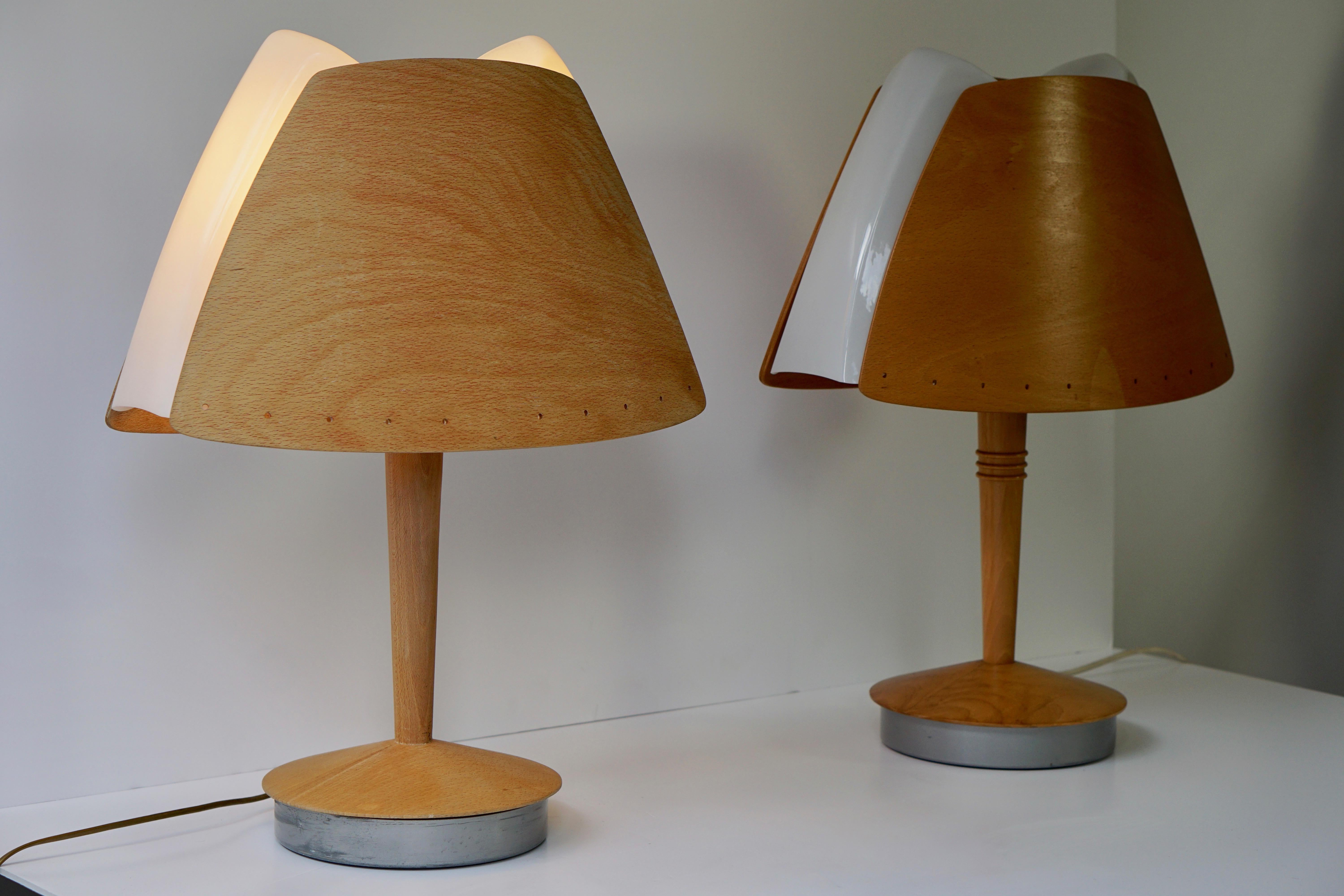 Two Lucid Harmonie table lamps by Soren Eriksen.

Materials: Beech wood round base, metal bottom. Beech wood rod and lampshade. White acrylic diffuser. Some metal and plastic parts. 2 Plastic sockets.

Height: 63,6 cm / 25.03”

Lampshade: 48 x 25,8