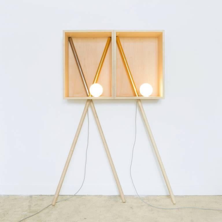 This object is present by the purity of its forms and of its structure. By using the proportions of the Golden Ratio, these precious wood rectangles contain a light bulb which will subdue your private space. Pénates 1, supported by one or two golden