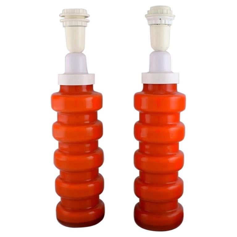 Po Ström para Alsterfors, Dos lámparas de sobremesa de vidrio soplado naranja