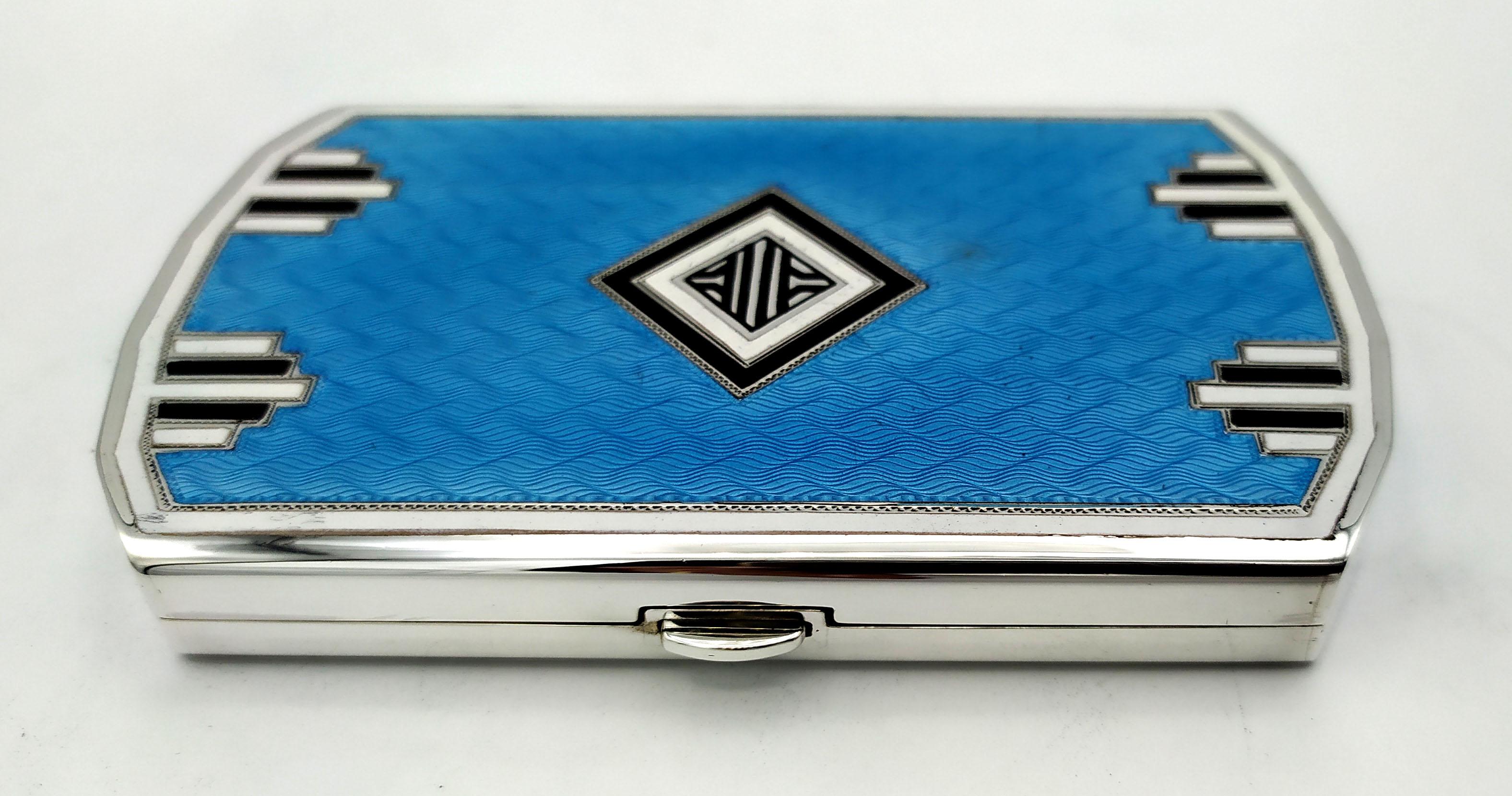 Shaped rectangular pocket cigarette case in 925/1000 sterling silver with translucent fired enamels on guillochè with Art Deco style geometric design, above and below. Opening with spring button and lost hinge, i.e. semi-invisible. Size cm. 6.7 x 11