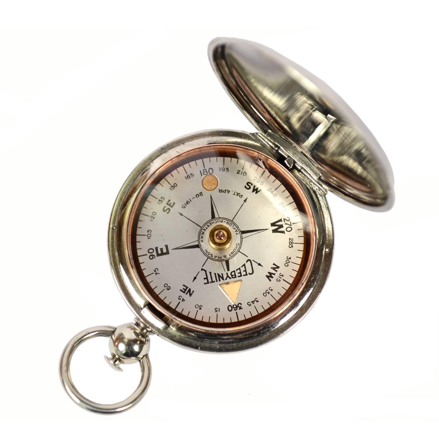 Pocket compass, 1915-1918, of chromed brass shaped like a pocket watch, signed Ceebynite Short & Mason Taylor Rochester N.Y. The compass has a snap-on cover with release button inside the ring. Compass card with four winds complete with a