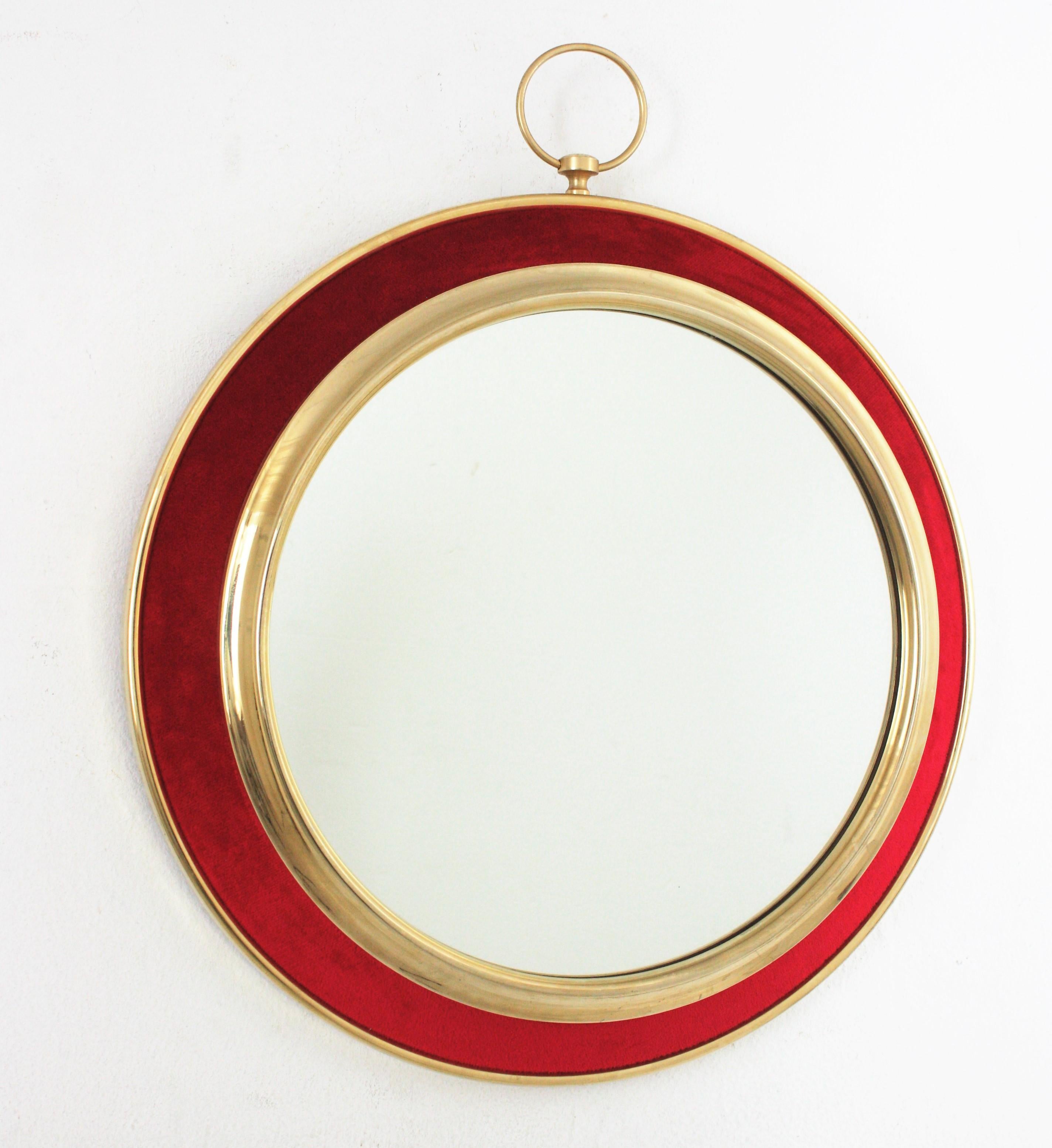 Red Velvet and Brass Pocket Watch Shaped Wall Mirror, Spain, 1950s-1960s
Eye-catching brass pocket watch shaped wall mirror in the style of Piero Fornasetti, his design has not lost its impact since the 1940s.
Nicely constructed and vibrant