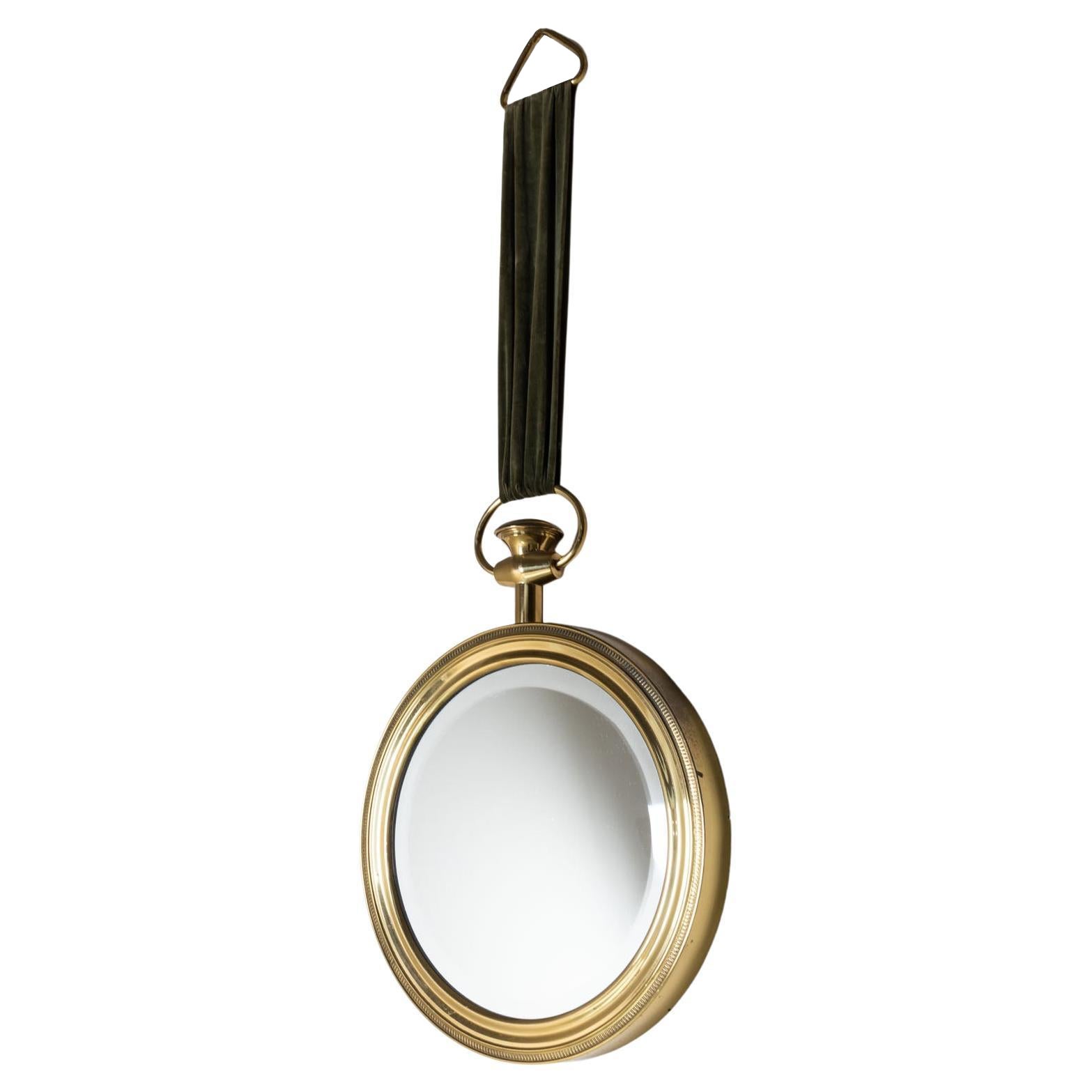 Specchio da parete con orologio da tasca in stile Piero Fornasetti, Italia