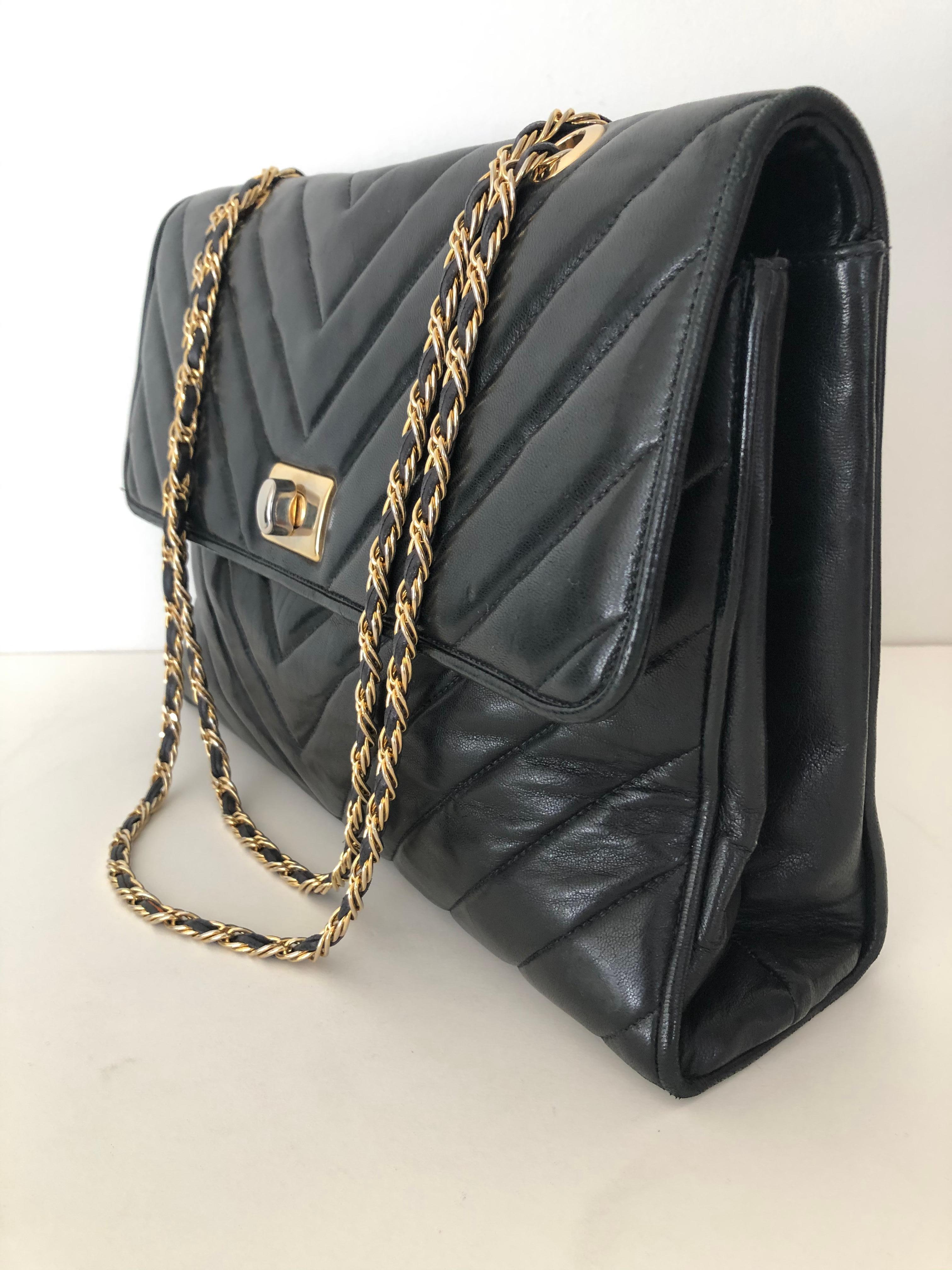 Black fine soft leather, channel design quilted large envelope shaped, double length long chain strap with leather woven, in very fine condition, top quality clean interior three compartment, zipper pouch . In the style of Chanel. Unmarked could be