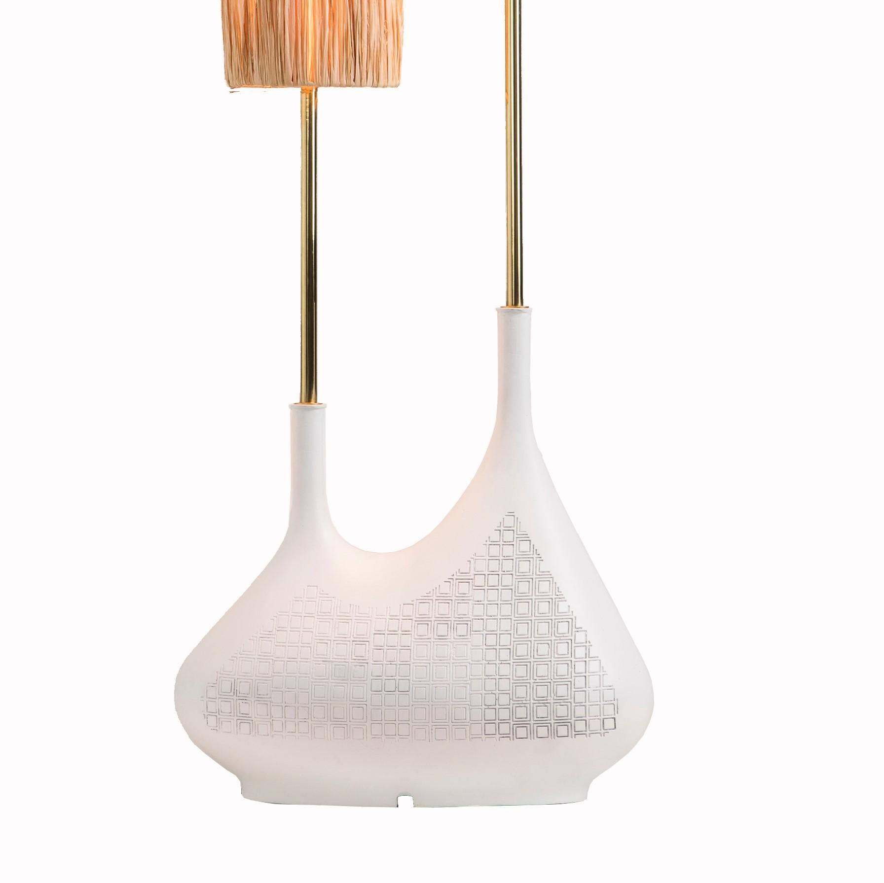 Pod double table lamp by Egg Designs
Dimensions: 45 L x 45 D x 68 H cm
Materials: Composite casting, brass, raffia

Founded by South Africans and life partners, Greg and Roche Dry - Egg is a unique perspective in contemporary furniture inspired