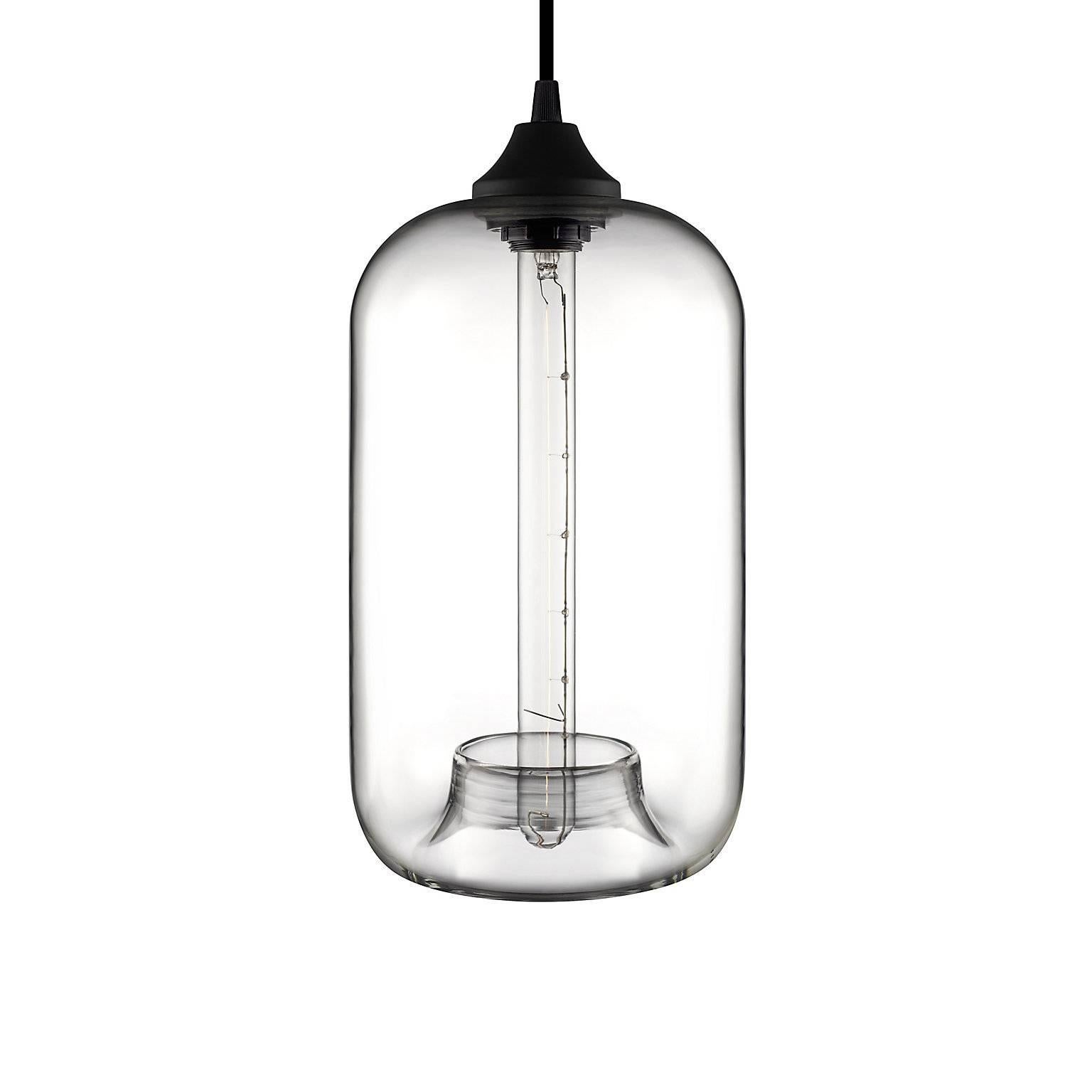 The distinctive handcrafted tuck defines the Pod pendant and draws the eye down the silhouette's long, cylindrical frame. Every single glass pendant light that comes from Niche is handblown by real human beings in a state-of-the-art studio located