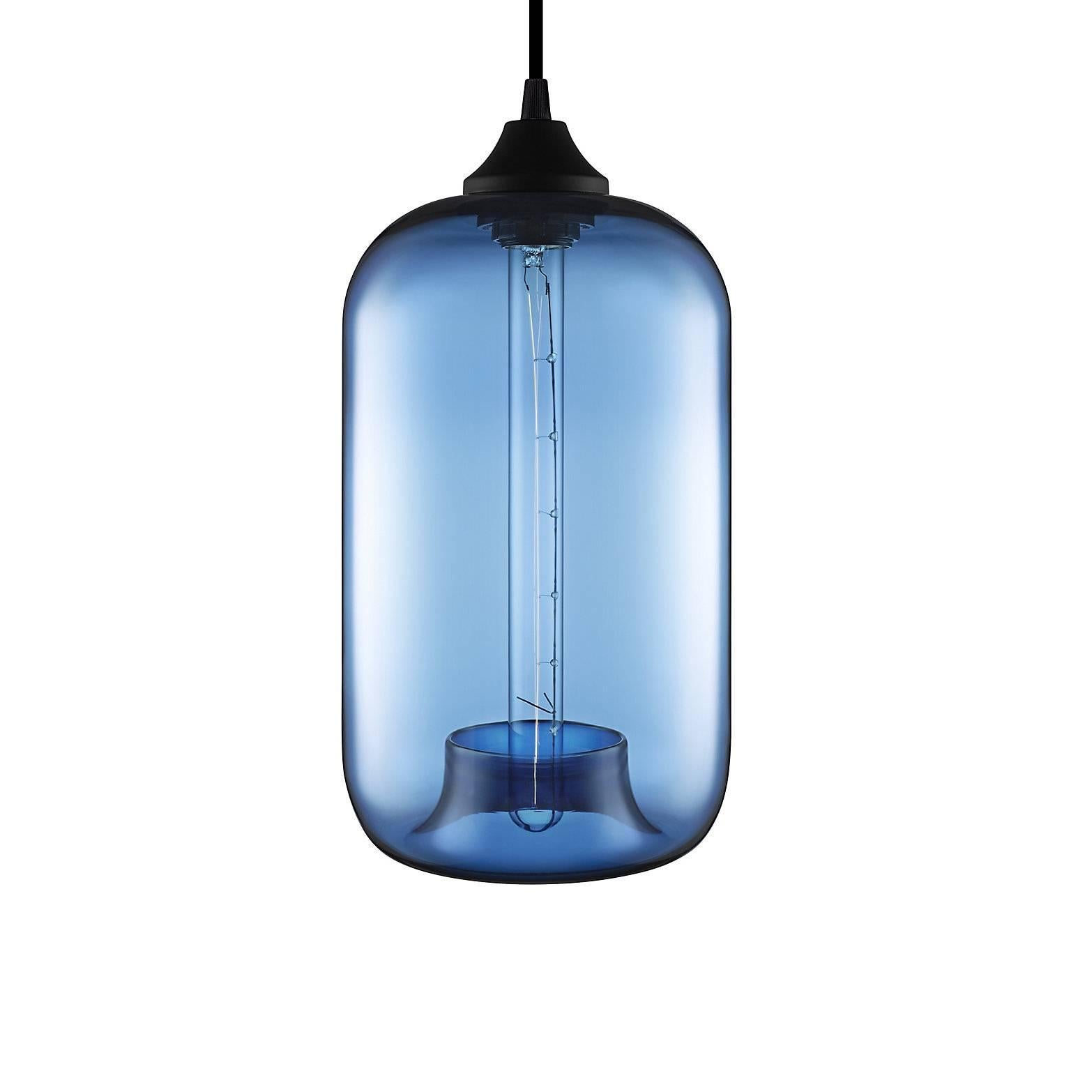 The distinctive handcrafted tuck defines the Pod pendant and draws the eye down the Silhouette's long, cylindrical frame. Every single glass pendant light that comes from Niche is handblown by real human beings in a state-of-the-art studio located