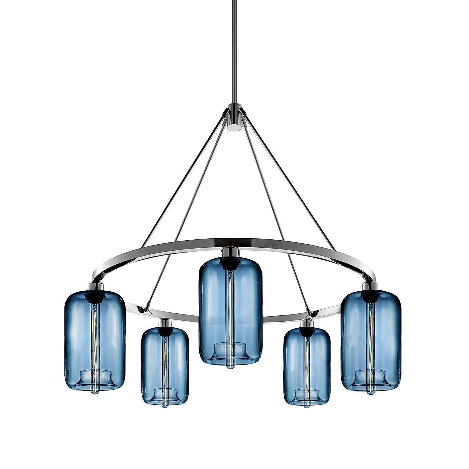 A statement piece designed to attract attention to the brilliant pod pendant, this chandelier captivates as it suspends elegant handblown shades. Every single glass light that comes from Niche is handblown by real human beings in a state-of-the-art