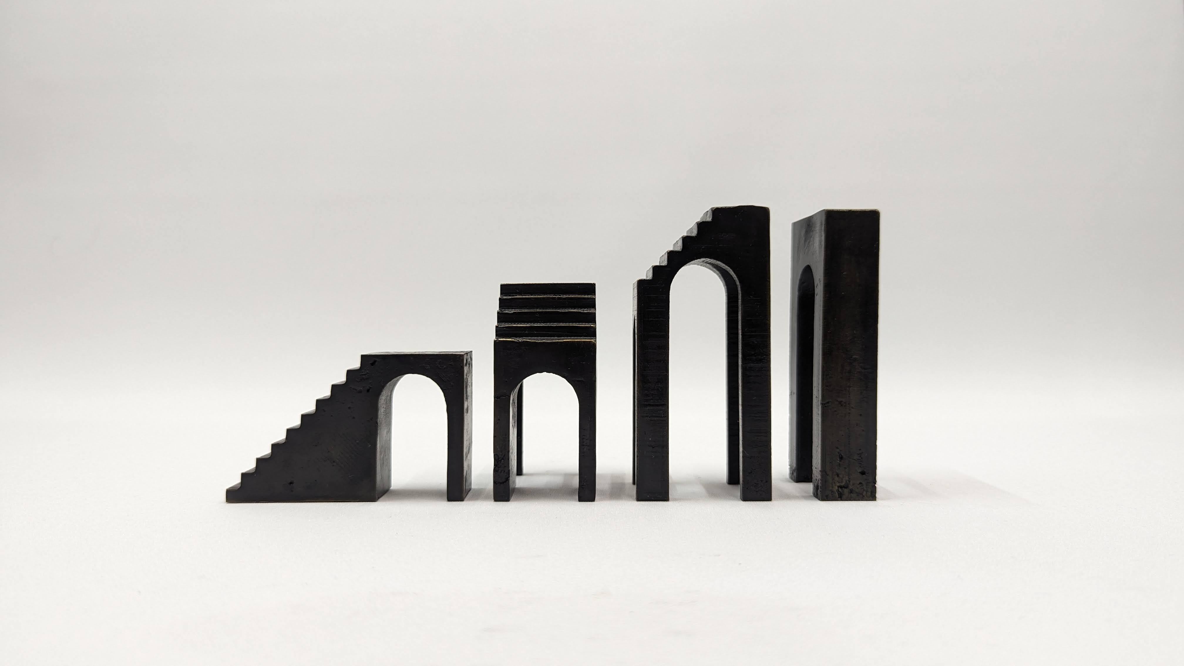 Beautiful architectural sculpture set, made out of bronze, with a black patina and a wax layer finish. The set is composed of four parts, that can be assembled such as a puzzled, as it pleases you. This is limited collectible edition of 8 samples