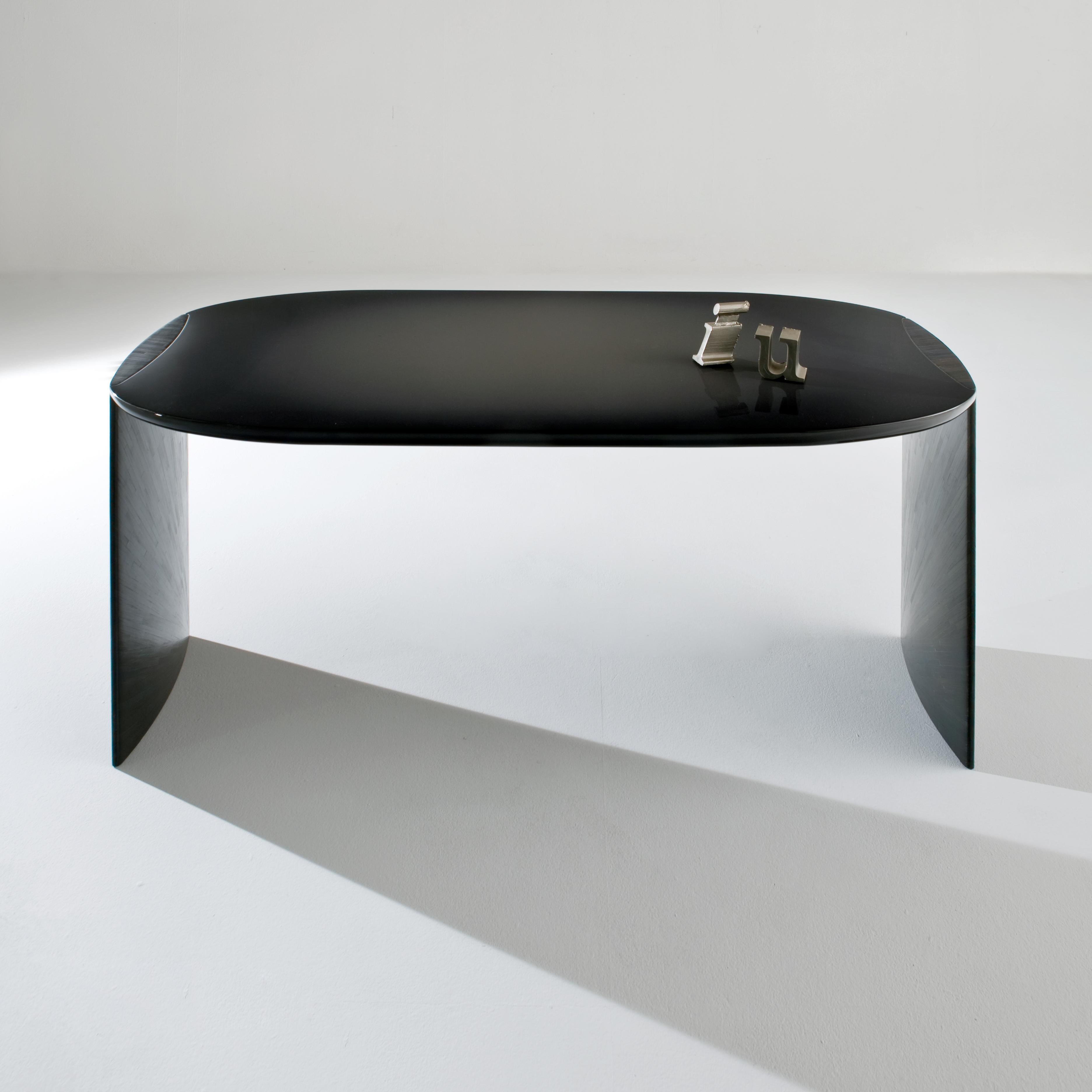 Poe Console Table by Laurameroni
Dimensions: W 160 x D 75 x H 73 cm
Materials: Shaded glossy lacquered wood black and black rye straw. 

Family of desks with round‐shaped top and legs with ovoidal section. Top in special shaded glossy lacquered wood